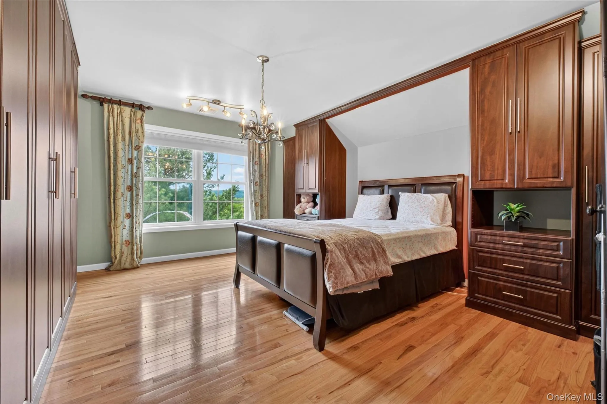 Jack & Jill Bedroom with custom California Closets built-ins, specialty storage, and dedicated jewelry cabinetry. Jack & Jill Bedroom with custom California Closets built-ins, specialty storage, and dedicated jewelry cabinetry.
