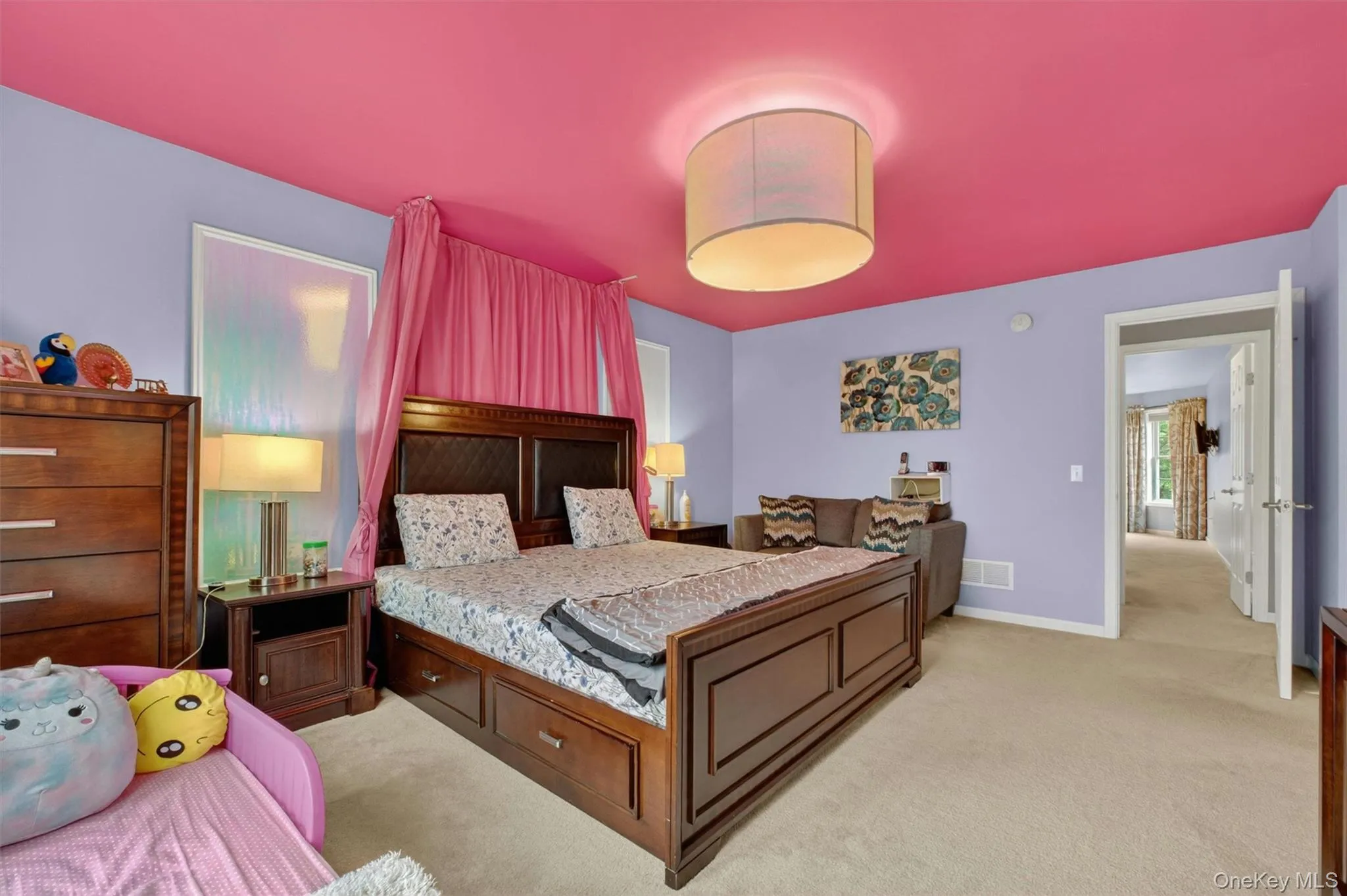 Vibrant Jack-and-Jill bedroom with custom details and walk-in closet cabinetry. Vibrant Jack-and-Jill bedroom with custom details and walk-in closet cabinetry.
