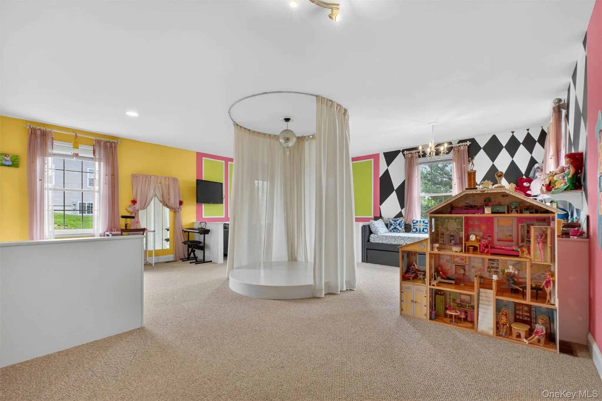 Expansive studio/recreation room with custom dance stage, specialty lighting, and flexible lounge or guest space. Expansive studio/recreation room with custom dance stage, specialty lighting, and flexible lounge or guest space.