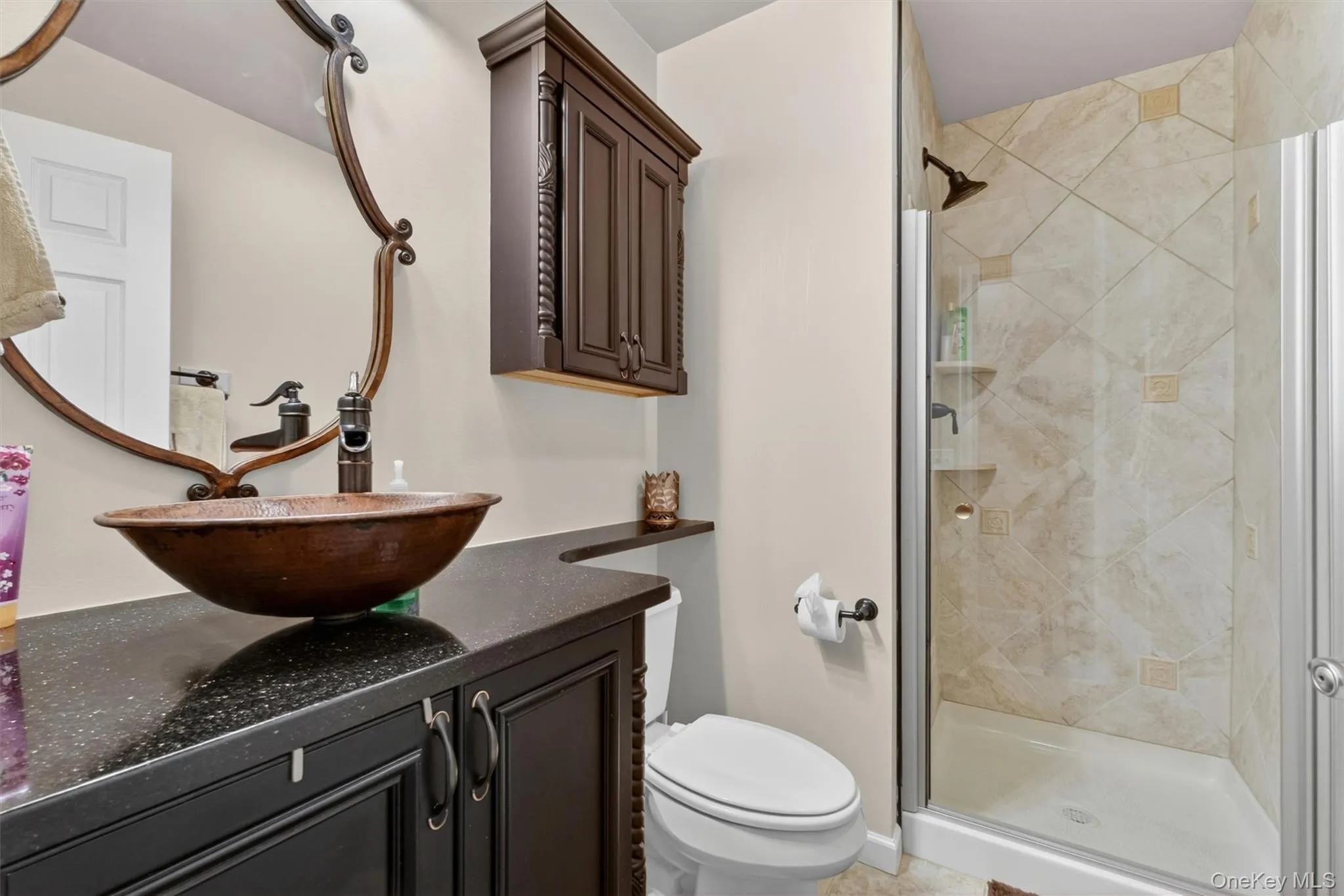 Princess suite bath with custom vanity and tiled glass-enclosed shower. Princess suite bath with custom vanity and tiled glass-enclosed shower.