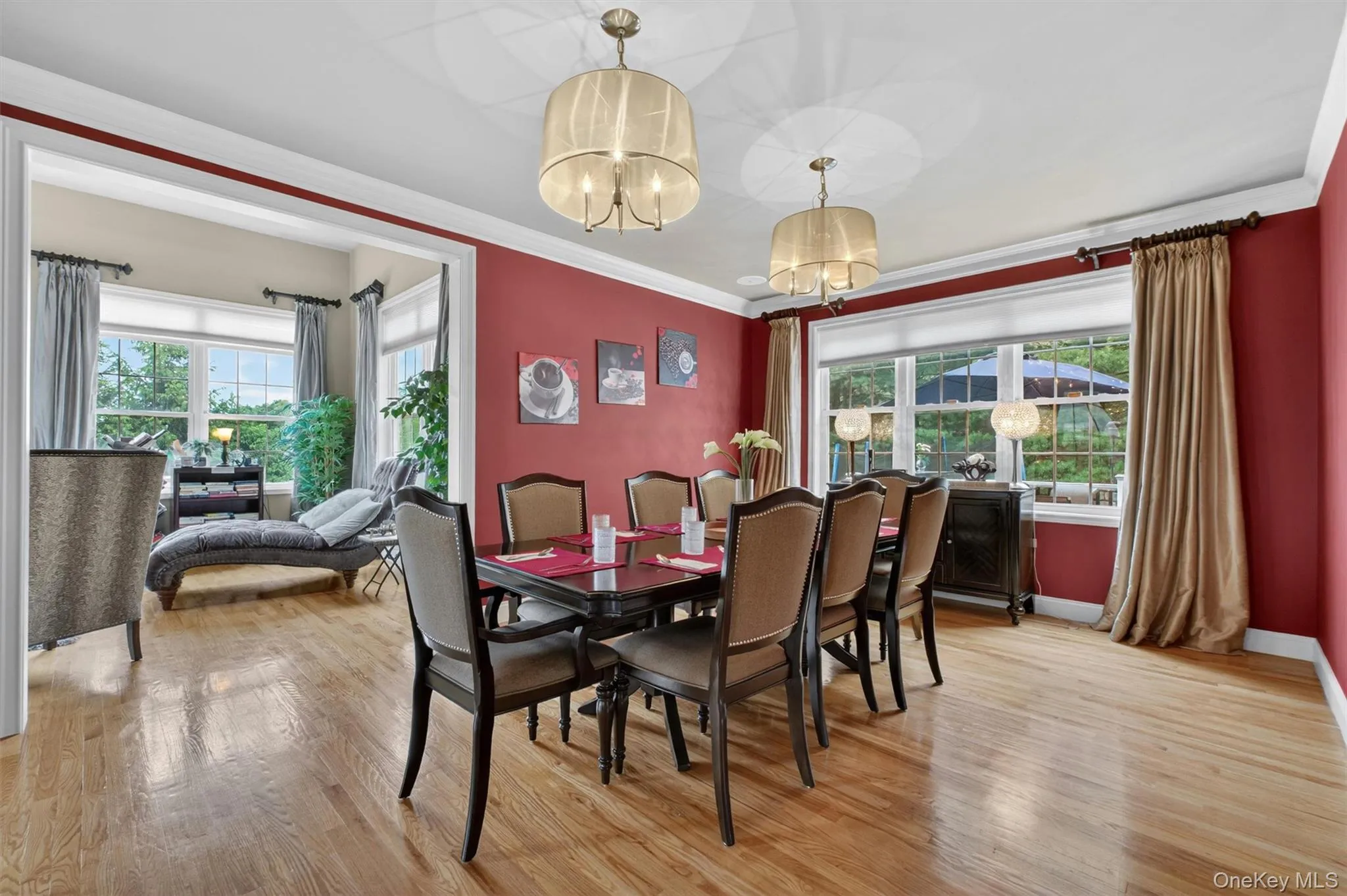 Large formal dining room with statement lighting, built-in ceiling speakers, and seamless flow to kitchen and living areas. Large formal dining room with statement lighting, built-in ceiling speakers, and seamless flow to kitchen and living areas.