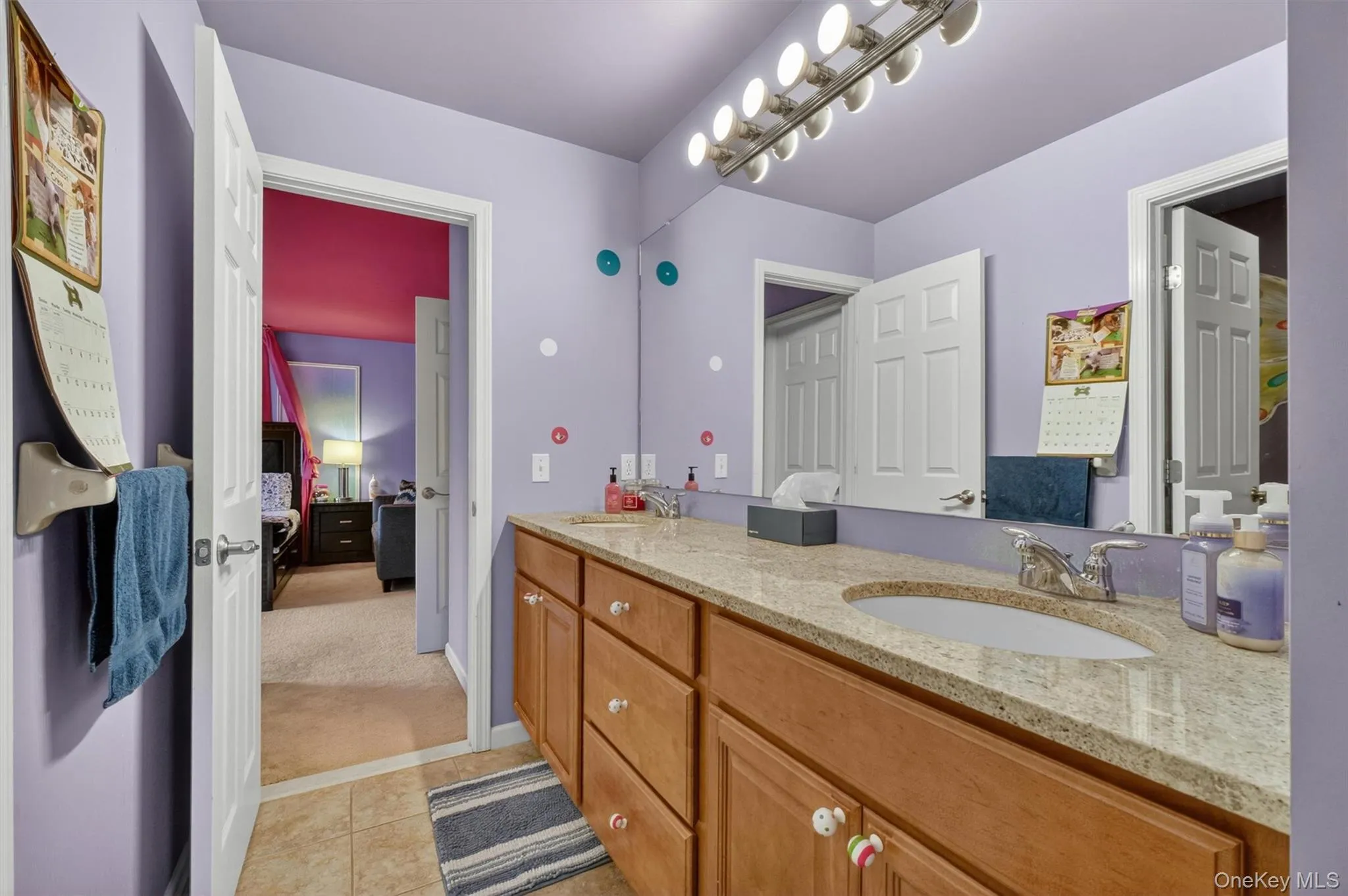 Well-appointed Jack-and-Jill bath with dual vanity and private tub/shower area. Well-appointed Jack-and-Jill bath with dual vanity and private tub/shower area.