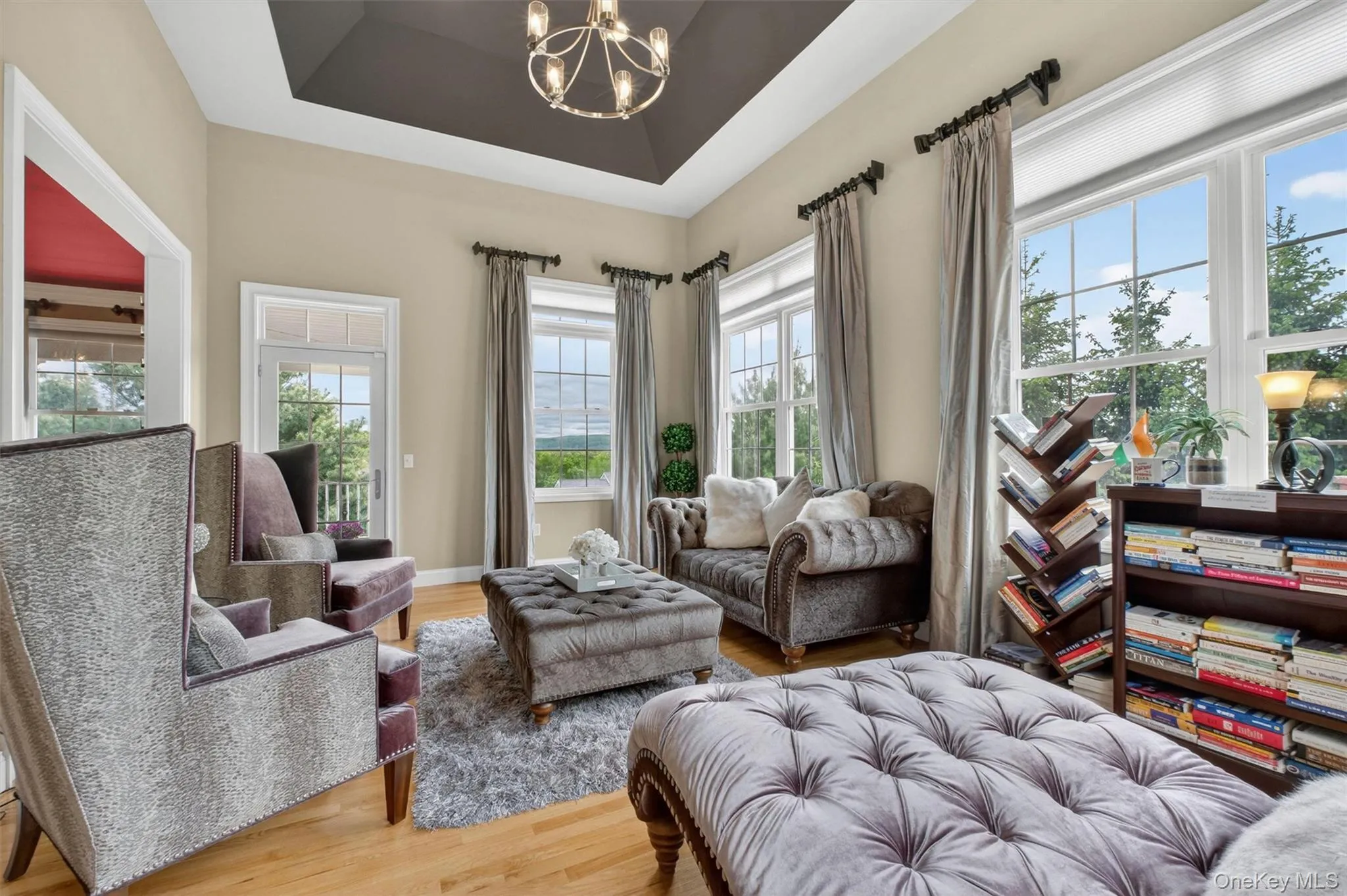 Sun-filled solarium with high coffered ceiling, custom draperies, and scenic views. Sun-filled solarium with high coffered ceiling, custom draperies, and scenic views.