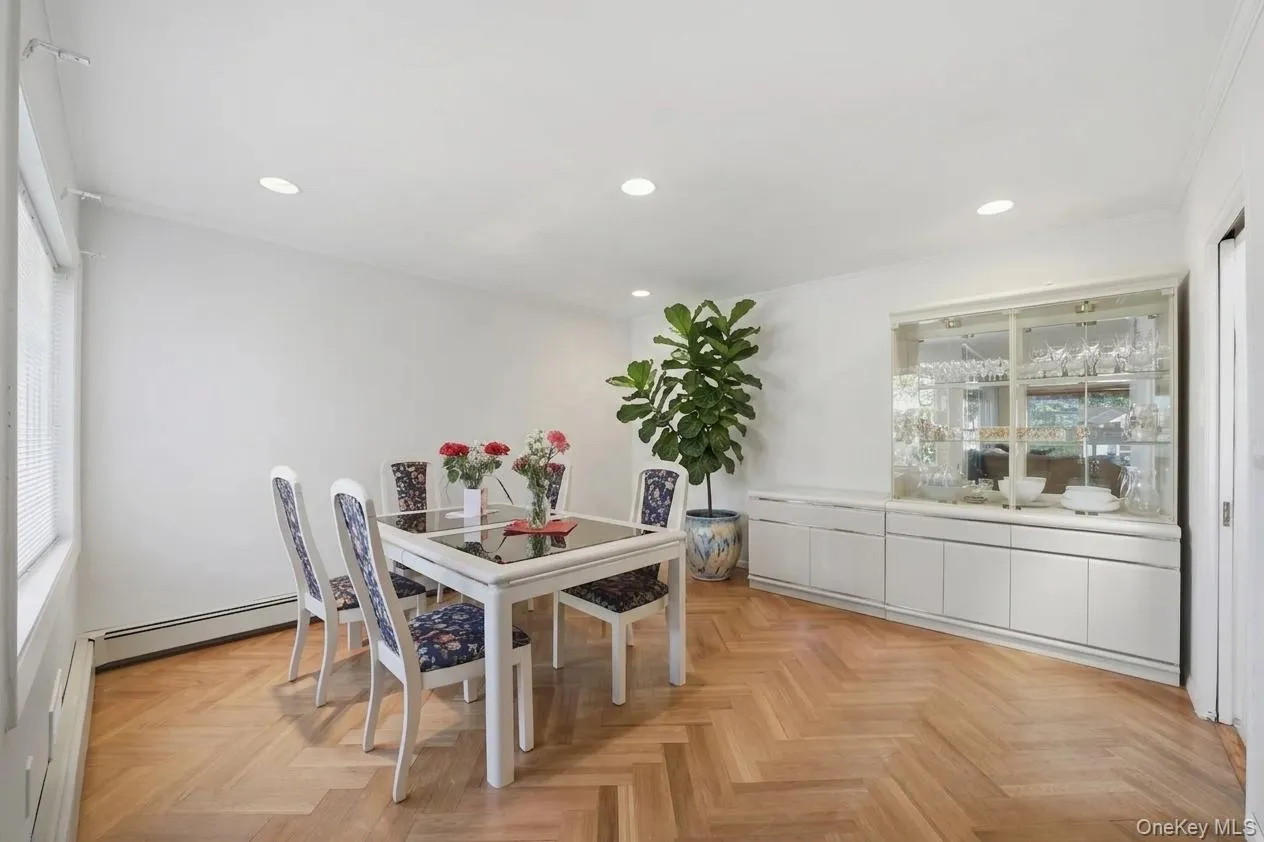Dining area featuring herringbone wood-finish flooring (Semi-Virtually Staged) Dining area featuring herringbone wood-finish flooring (Semi-Virtually Staged)