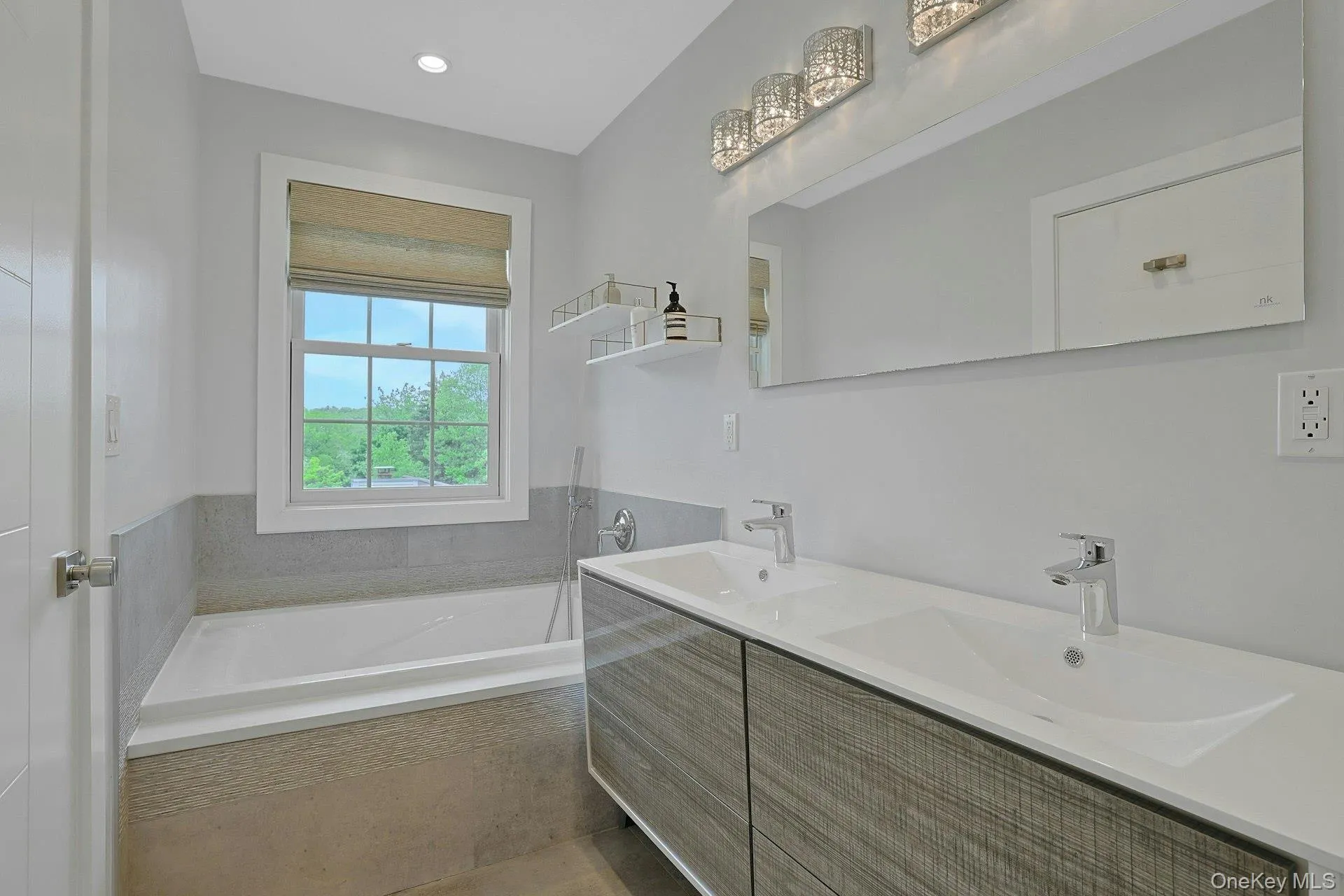 Primary ensuite bathroom with soaking tub and dual sinks Primary ensuite bathroom with soaking tub and dual sinks