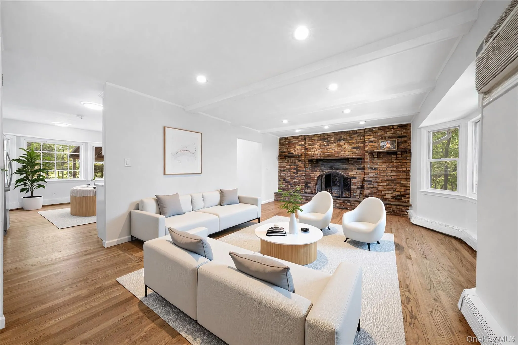 Living room with wood-finish flooring and recessed lighting. Image is Virtually Staged. Living room with wood-finish flooring and recessed lighting. Image is Virtually Staged.