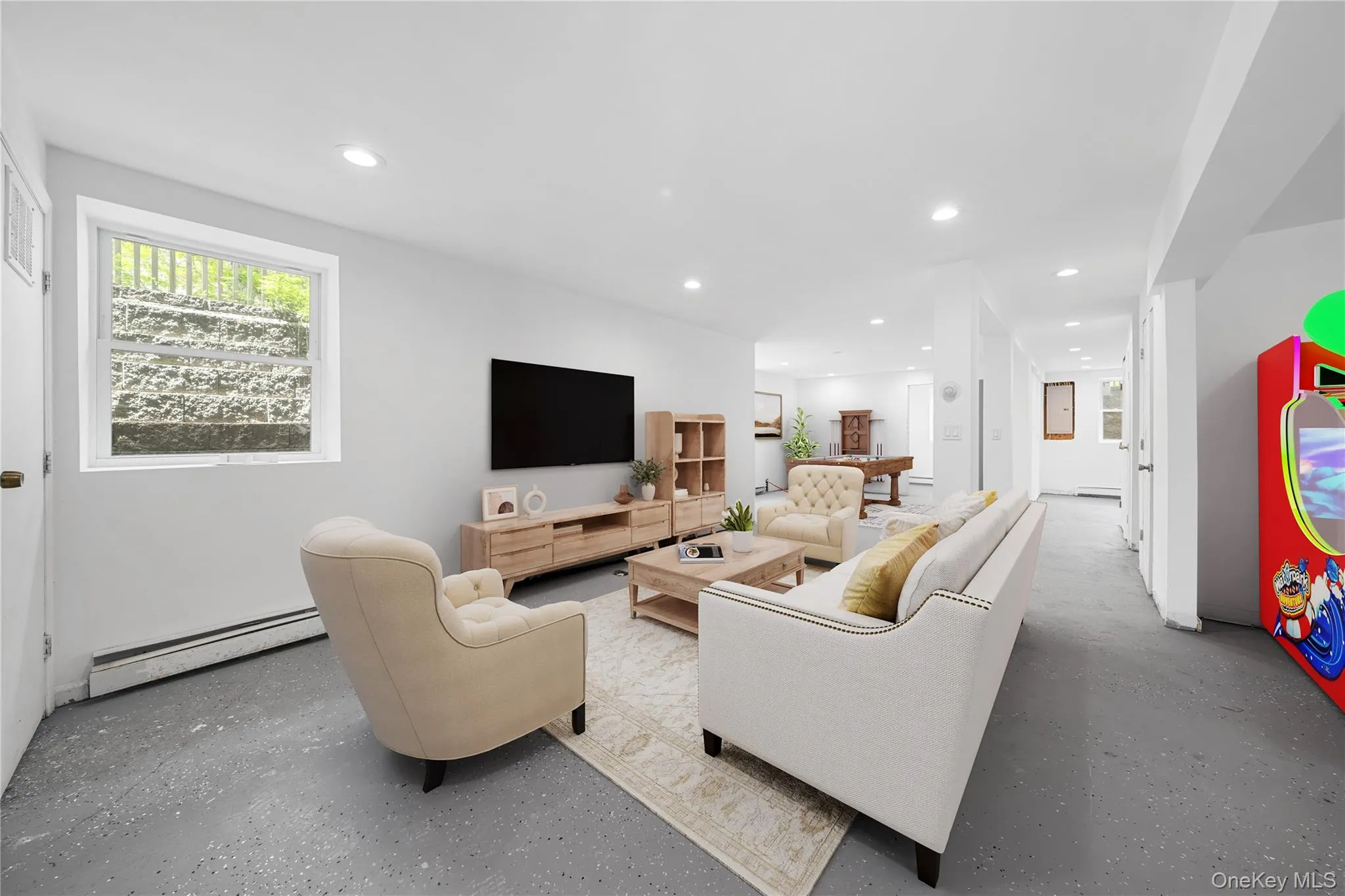 Spacious interior featuring light gray walls, recessed lighting, and a window with egress window. Image is Virtually Staged. Spacious interior featuring light gray walls, recessed lighting, and a window with egress window. Image is Virtually Staged.