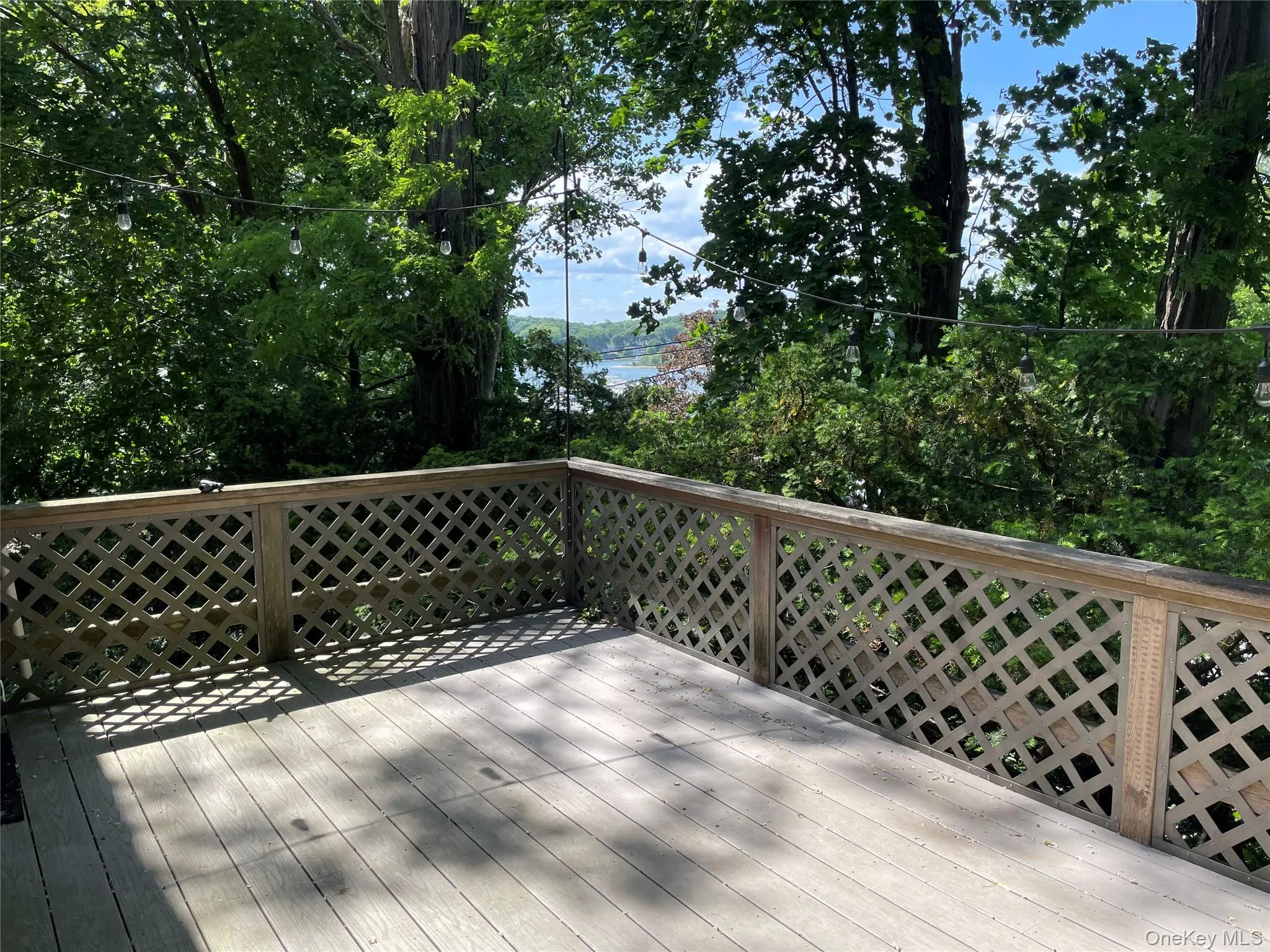 Deck featuring winter water views Deck featuring winter water views
