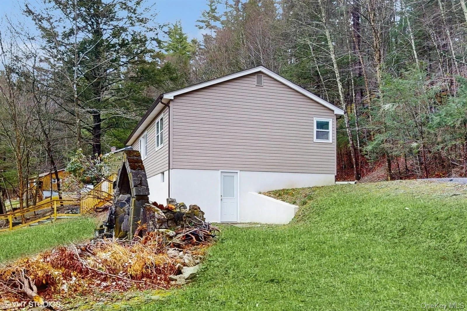 View of home's exterior with a yard View of home's exterior with a yard