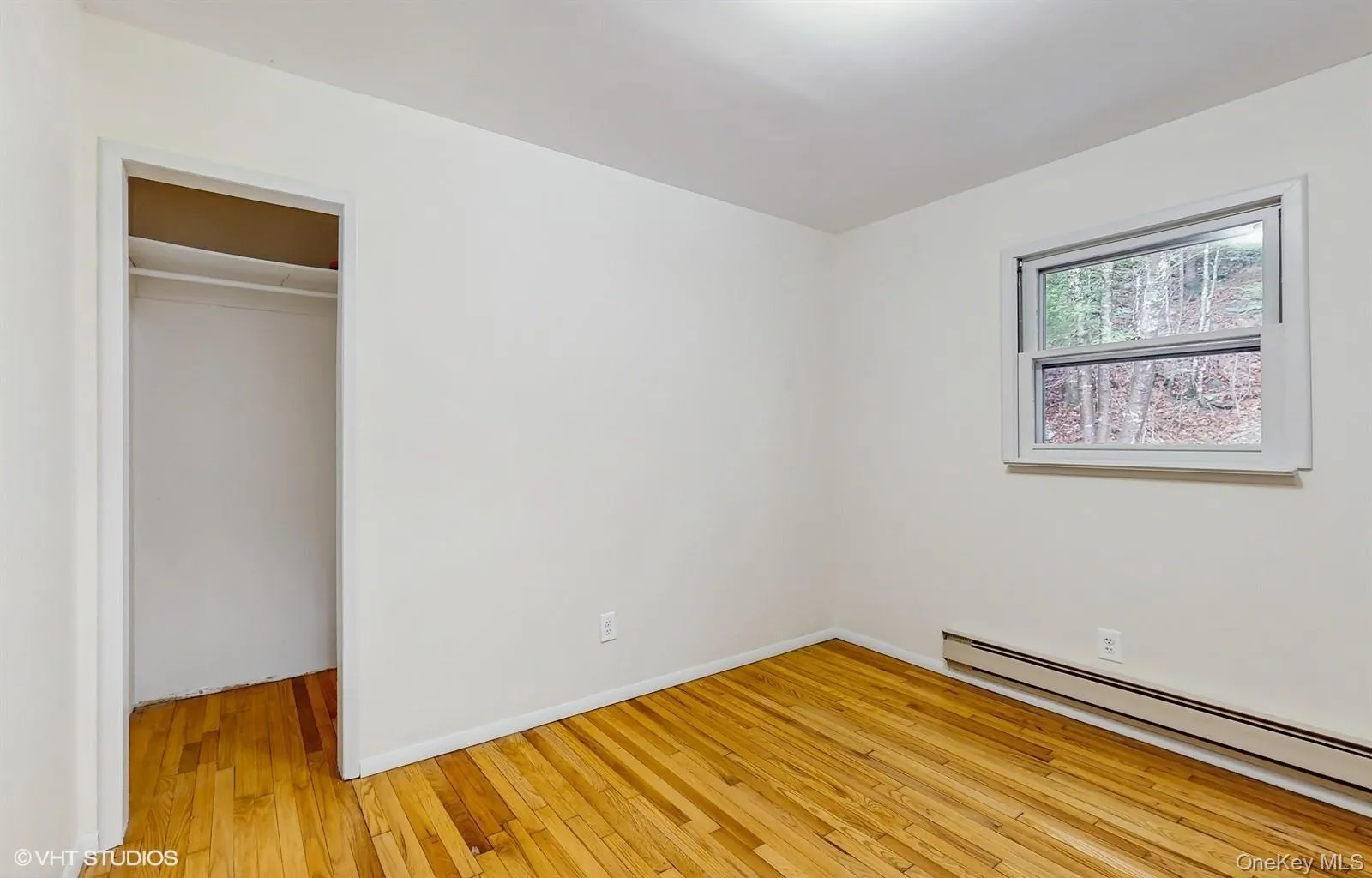 Unfurnished bedroom featuring a closet, light wood-style floors Unfurnished bedroom featuring a closet, light wood-style floors