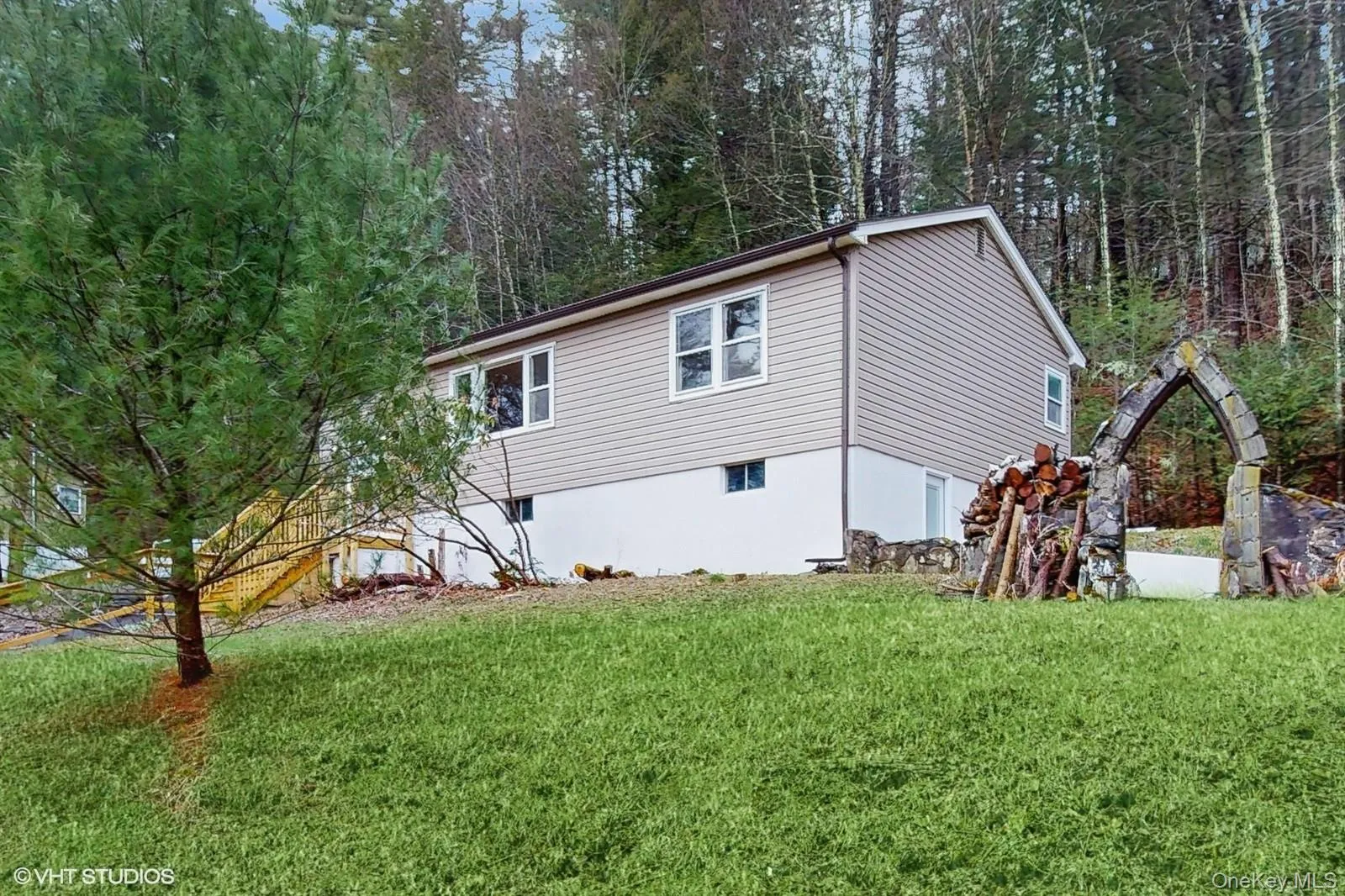 View of home's exterior featuring a yard View of home's exterior featuring a yard