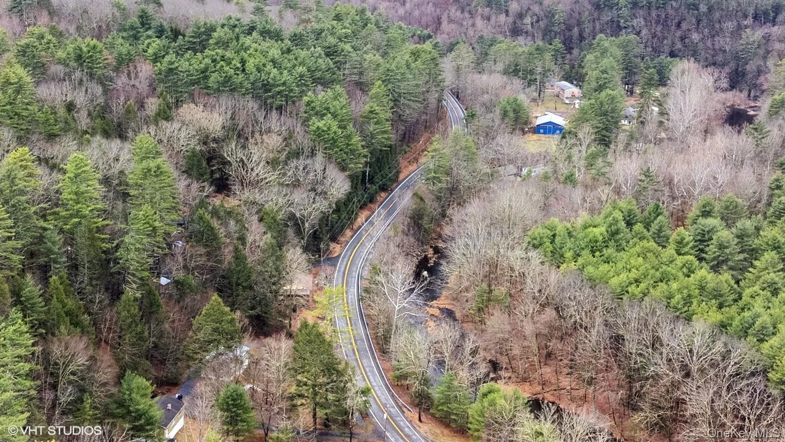 Drone / aerial view featuring a forest view Drone / aerial view featuring a forest view