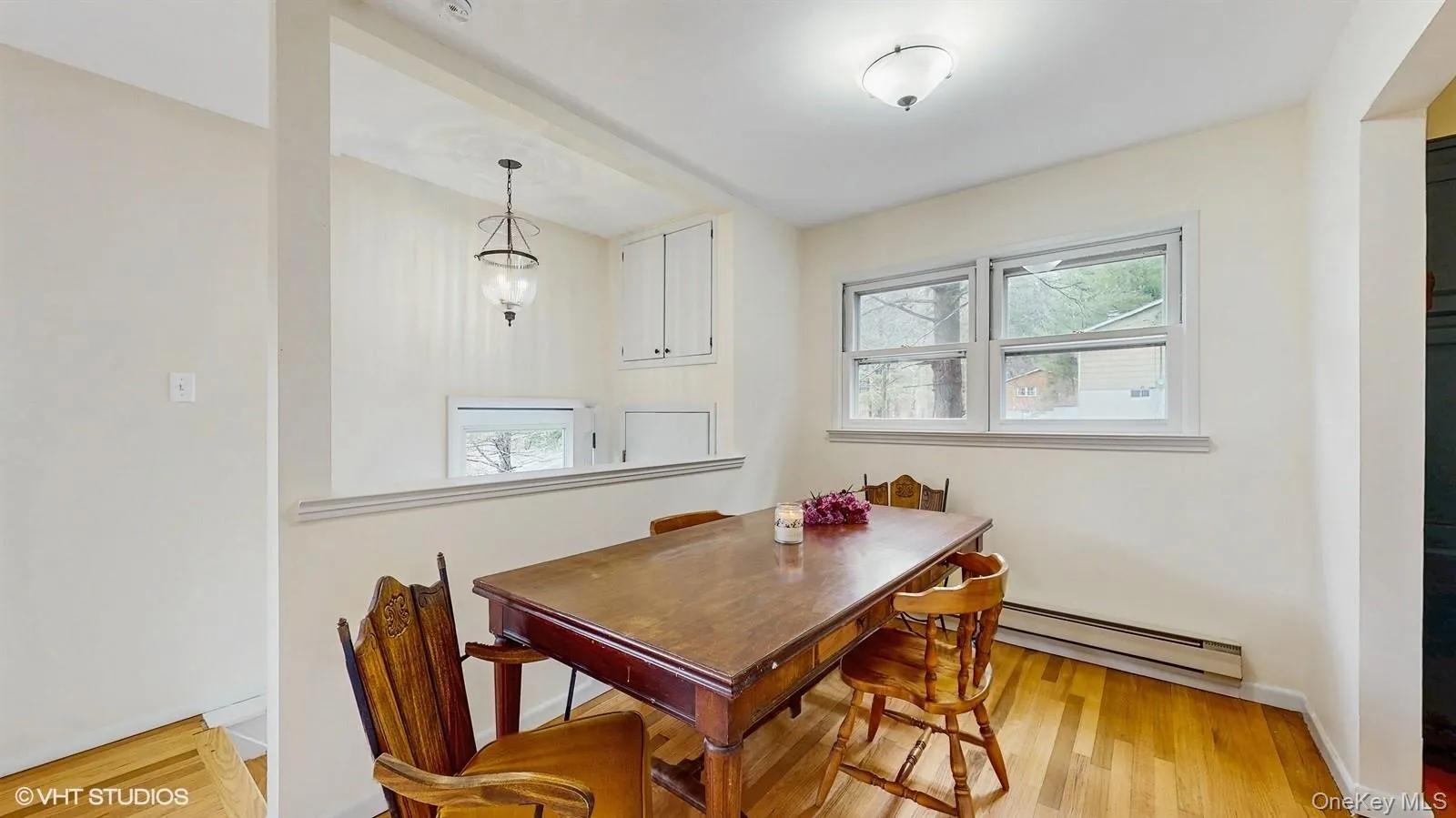 Dining space with light wood-style floors Dining space with light wood-style floors