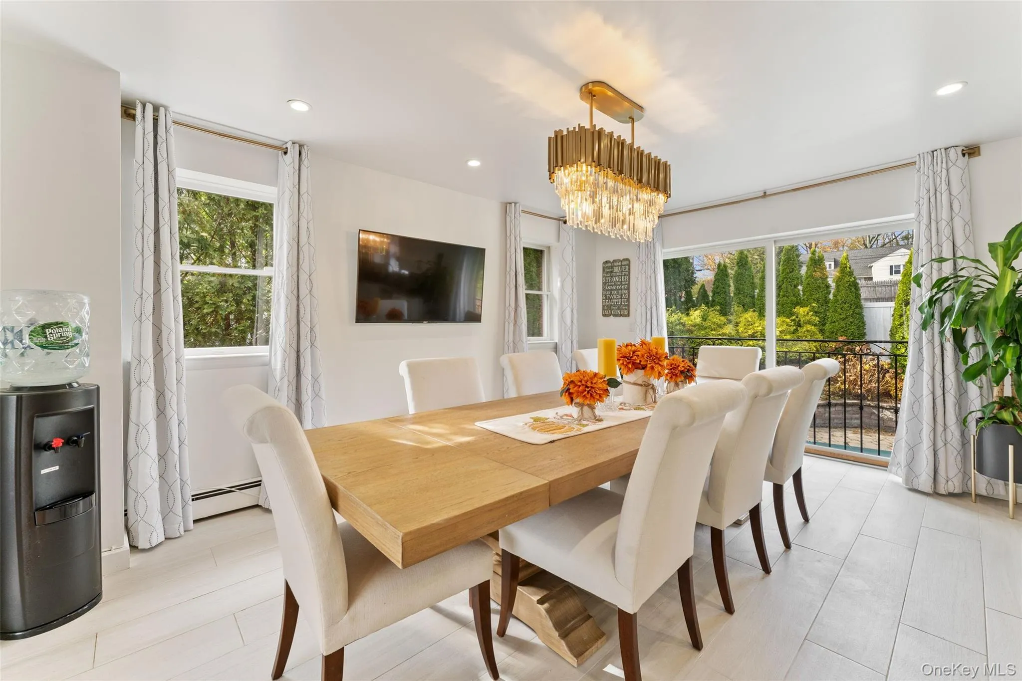 Dining area that has a Juliet balcony overlooking the backyard Dining area that has a Juliet balcony overlooking the backyard