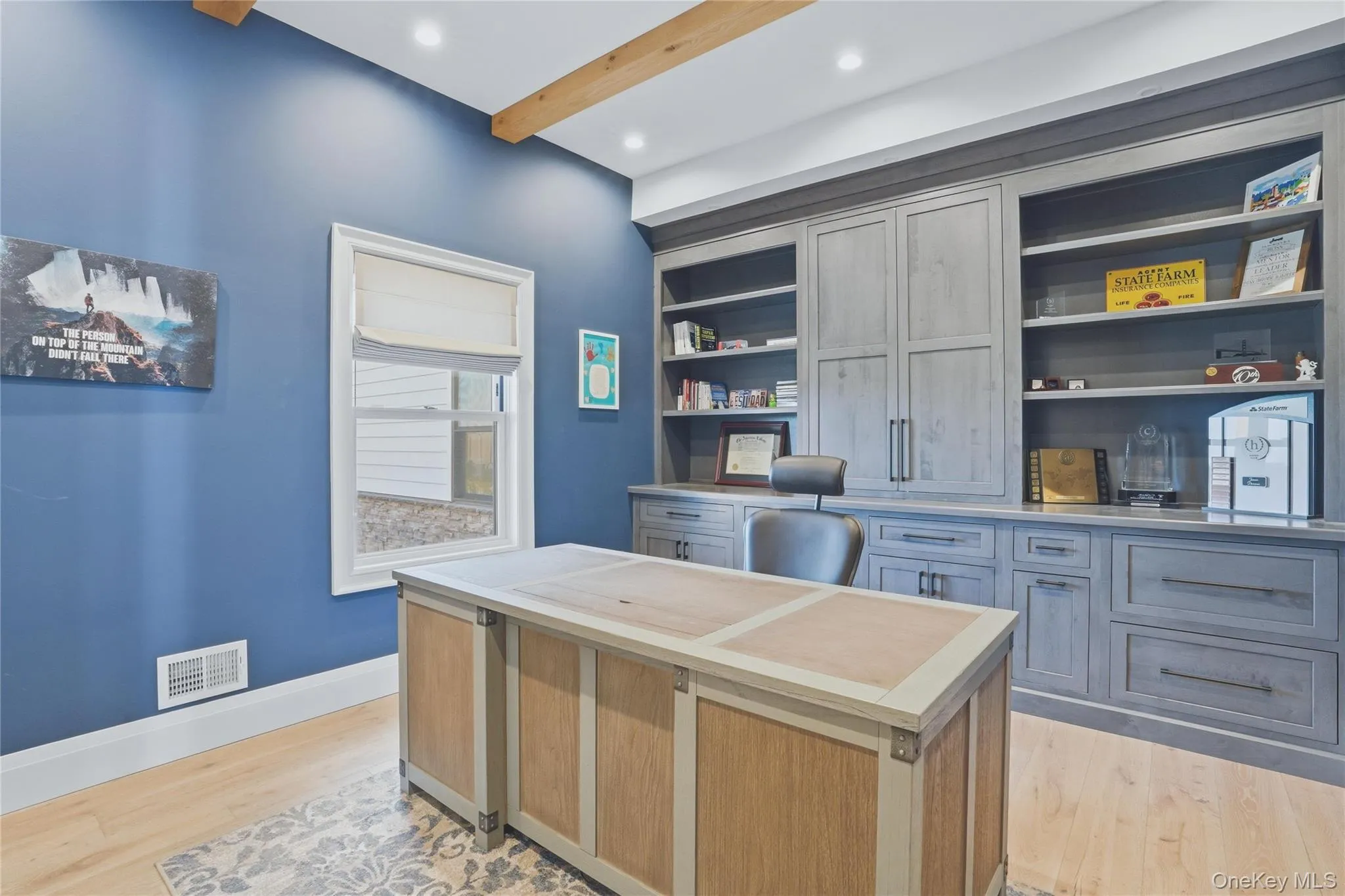 Expansive built-in cabinetry with integrated shelving and drawers, wood-finish flooring, high ceilings with exposed wood beams, and recessed lighting Expansive built-in cabinetry with integrated shelving and drawers, wood-finish flooring, high ceilings with exposed wood beams, and recessed lighting