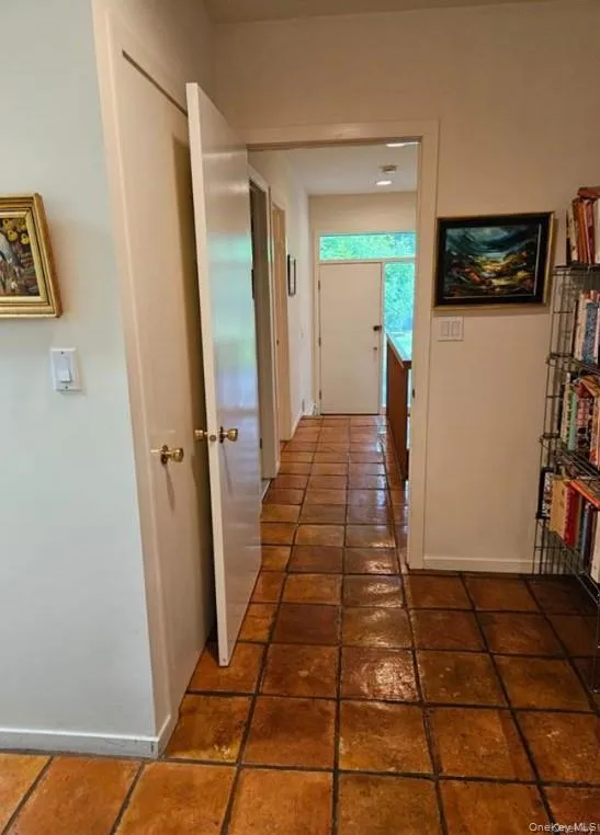 View to Side Door. This wing, (Bedroom, Bathroom, including 2nd stairway leading to Basement), has a privacy door. View to Side Door. This wing, (Bedroom, Bathroom, including 2nd stairway leading to Basement), has a privacy door.