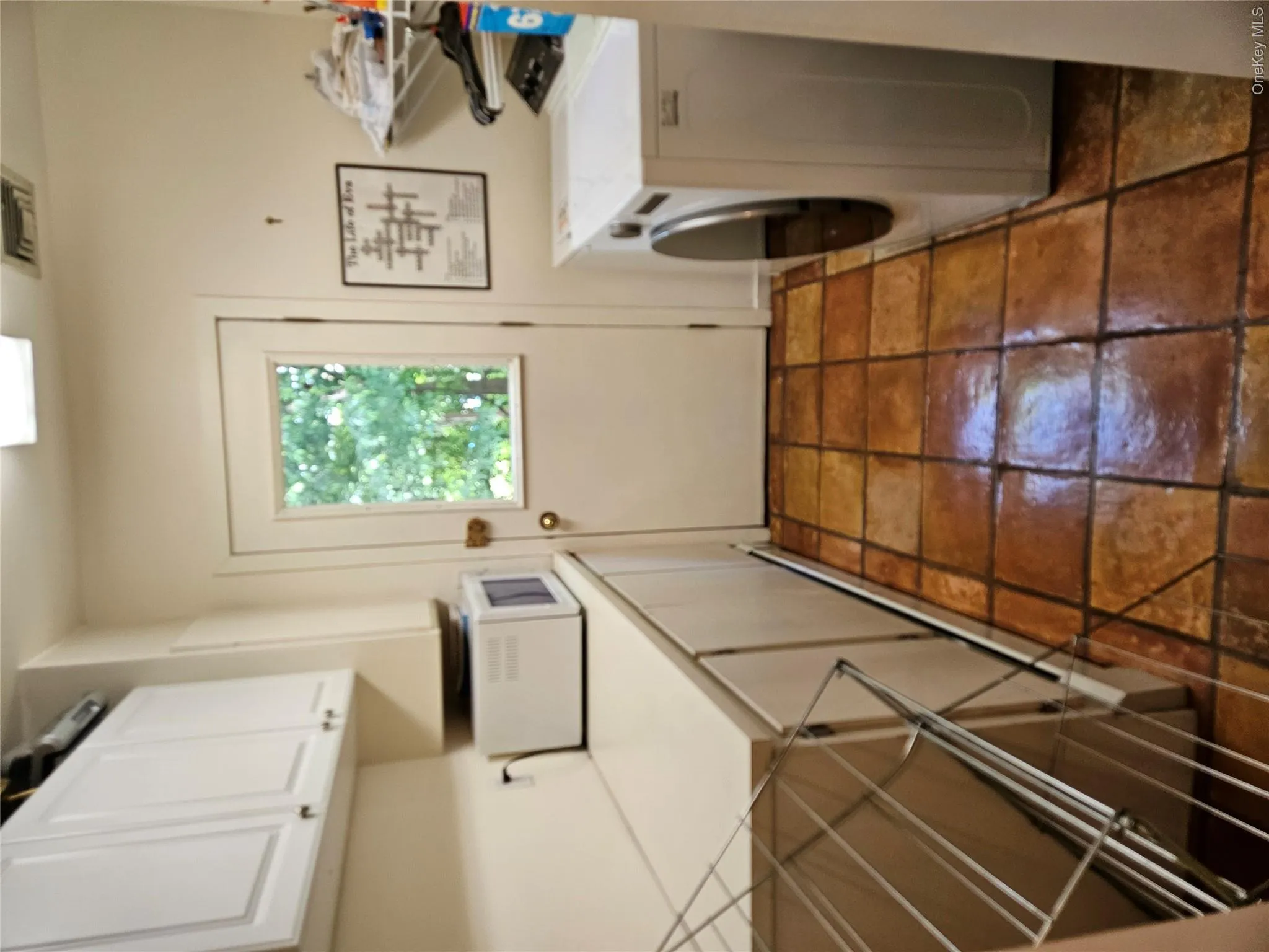 Laundry Room w/Slop Sink and the Handcrafted Mexican Terracotta Tiles that continue to the Side Door Laundry Room w/Slop Sink and the Handcrafted Mexican Terracotta Tiles that continue to the Side Door