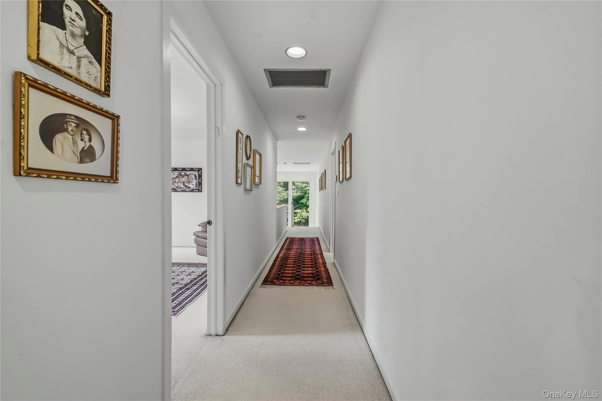 Extra wide upstairs Hallway culminates in Huge Windows at 2 Story Landing Extra wide upstairs Hallway culminates in Huge Windows at 2 Story Landing