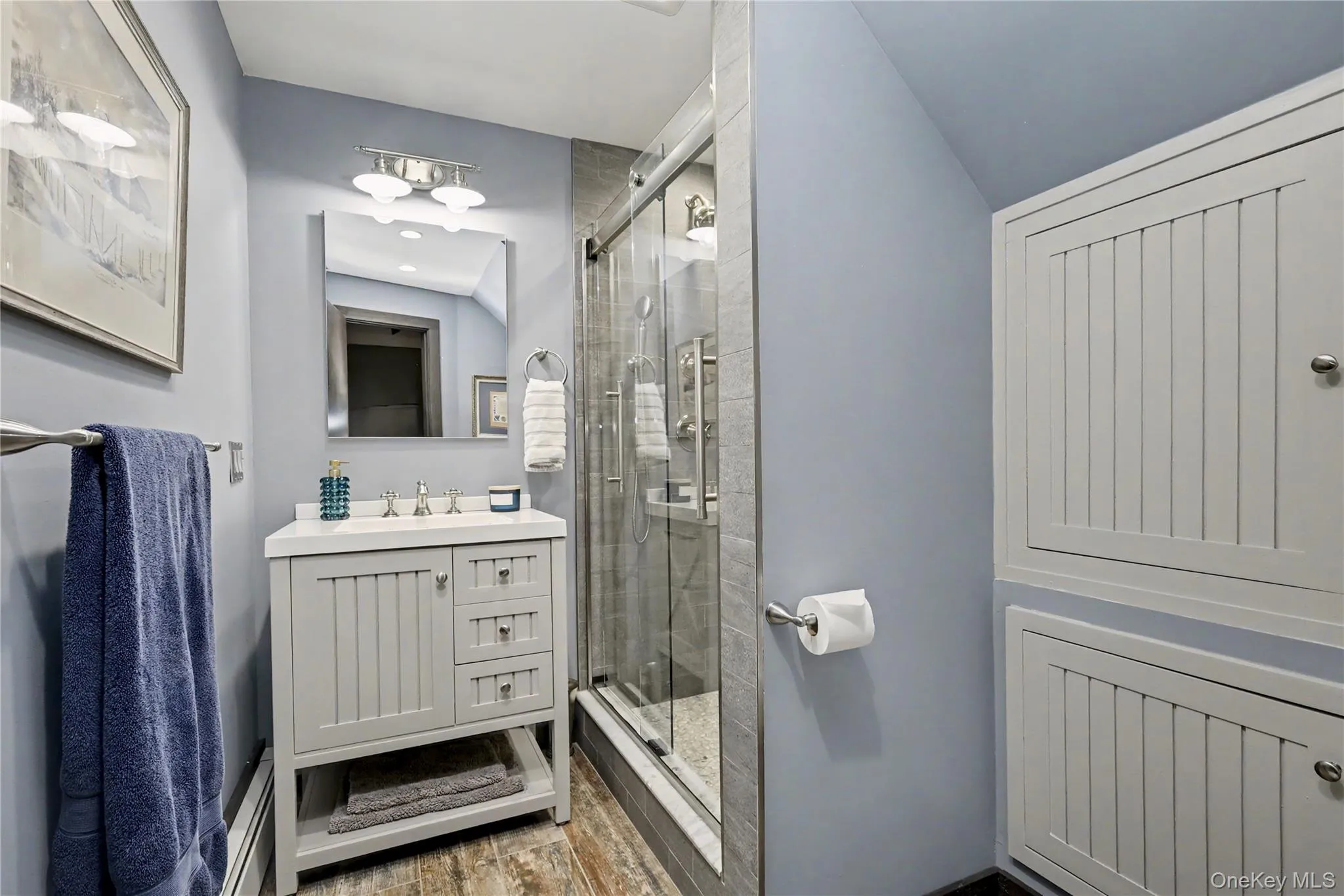 Fully renovated lower level bathroom with plenty of storage. Fully renovated lower level bathroom with plenty of storage.