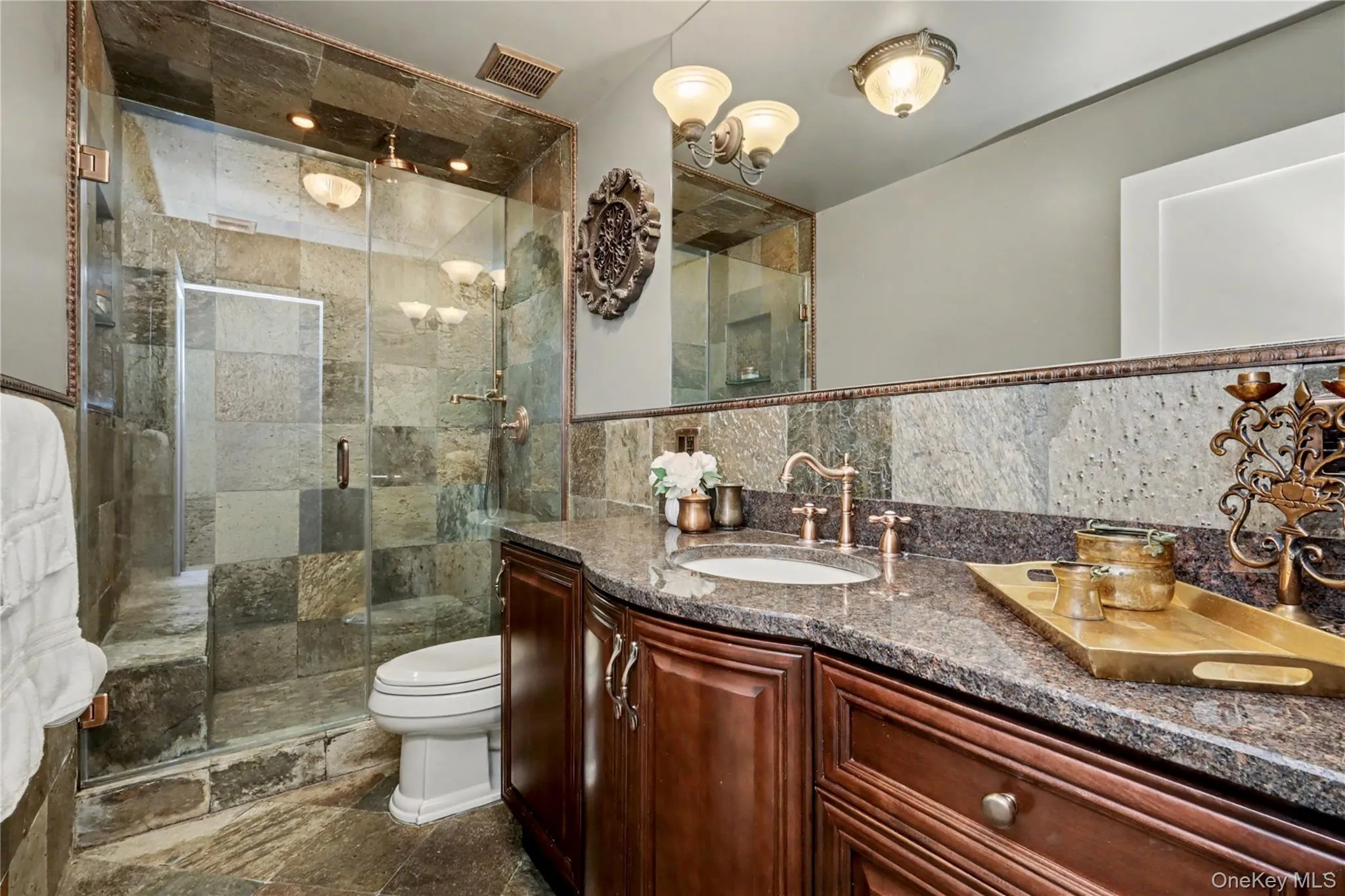 Main floor hall bathroom with heated floors and custom slate shower. Main floor hall bathroom with heated floors and custom slate shower.