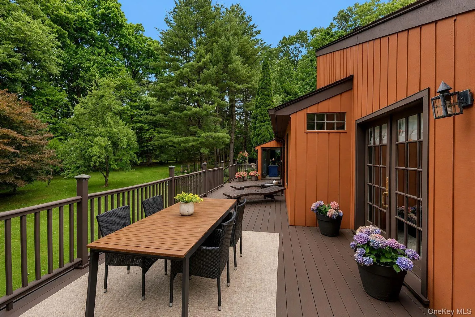 Surrounded by mature trees, this expansive wraparound deck offers a private and peaceful retreat. Surrounded by mature trees, this expansive wraparound deck offers a private and peaceful retreat.