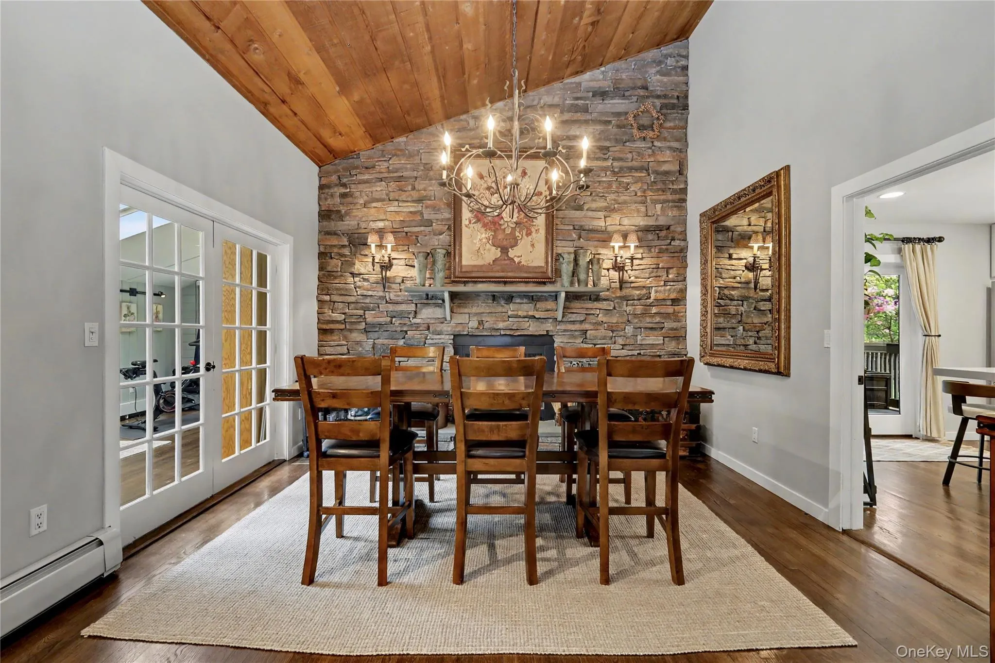 Dining area with vaulted ceilings, woodburning fireplace, slate mantle and hearth. Dining area with vaulted ceilings, woodburning fireplace, slate mantle and hearth.