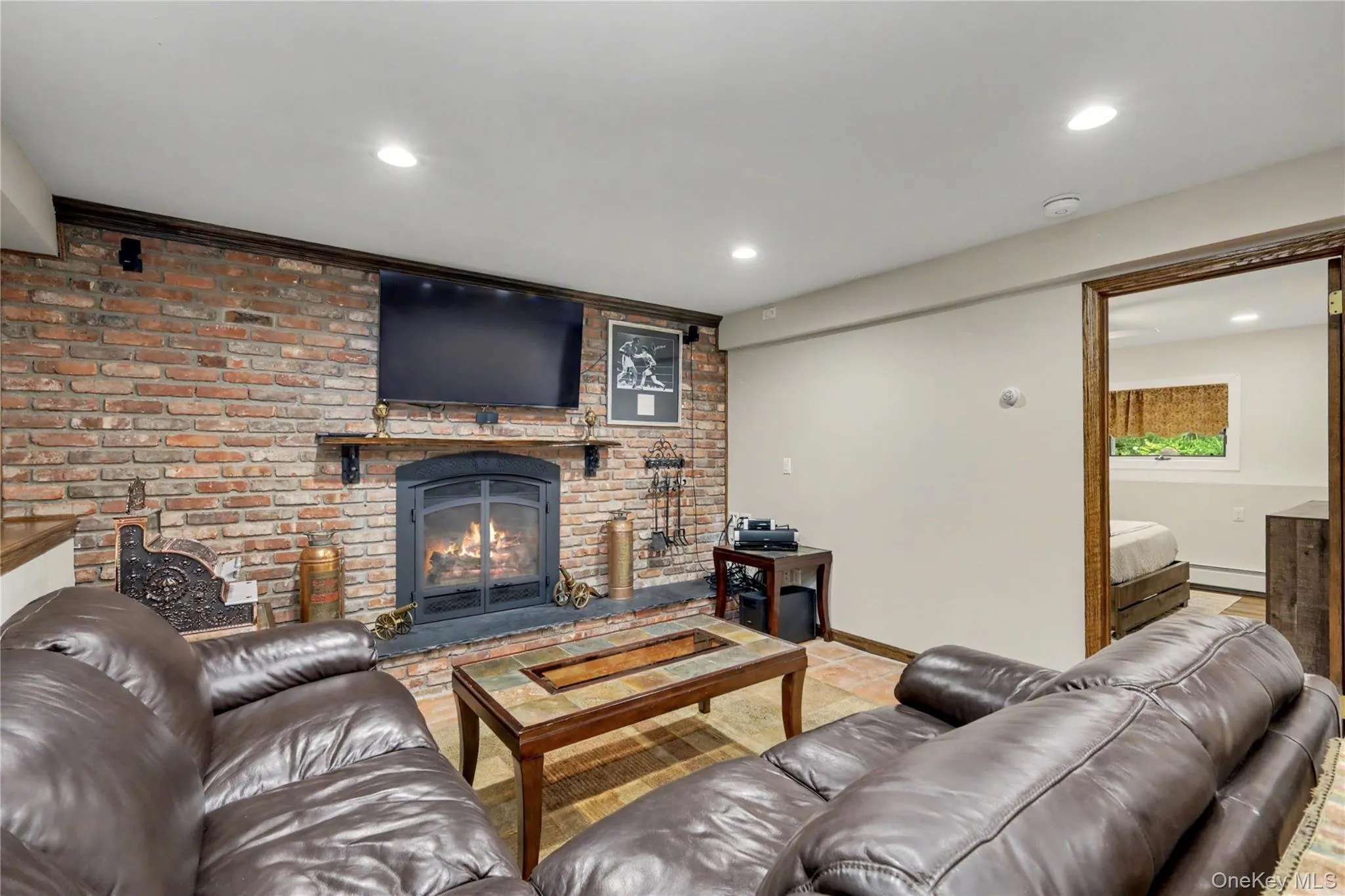 Lower level family room with gas fireplace creates a welcoming atmosphere for relaxation and entertaining. Lower level family room with gas fireplace creates a welcoming atmosphere for relaxation and entertaining.