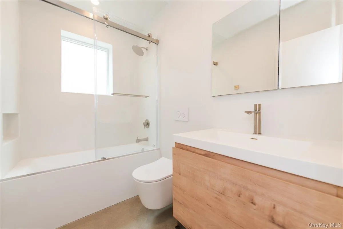 Full bath with enclosed tub / shower combo and vanity Full bath with enclosed tub / shower combo and vanity