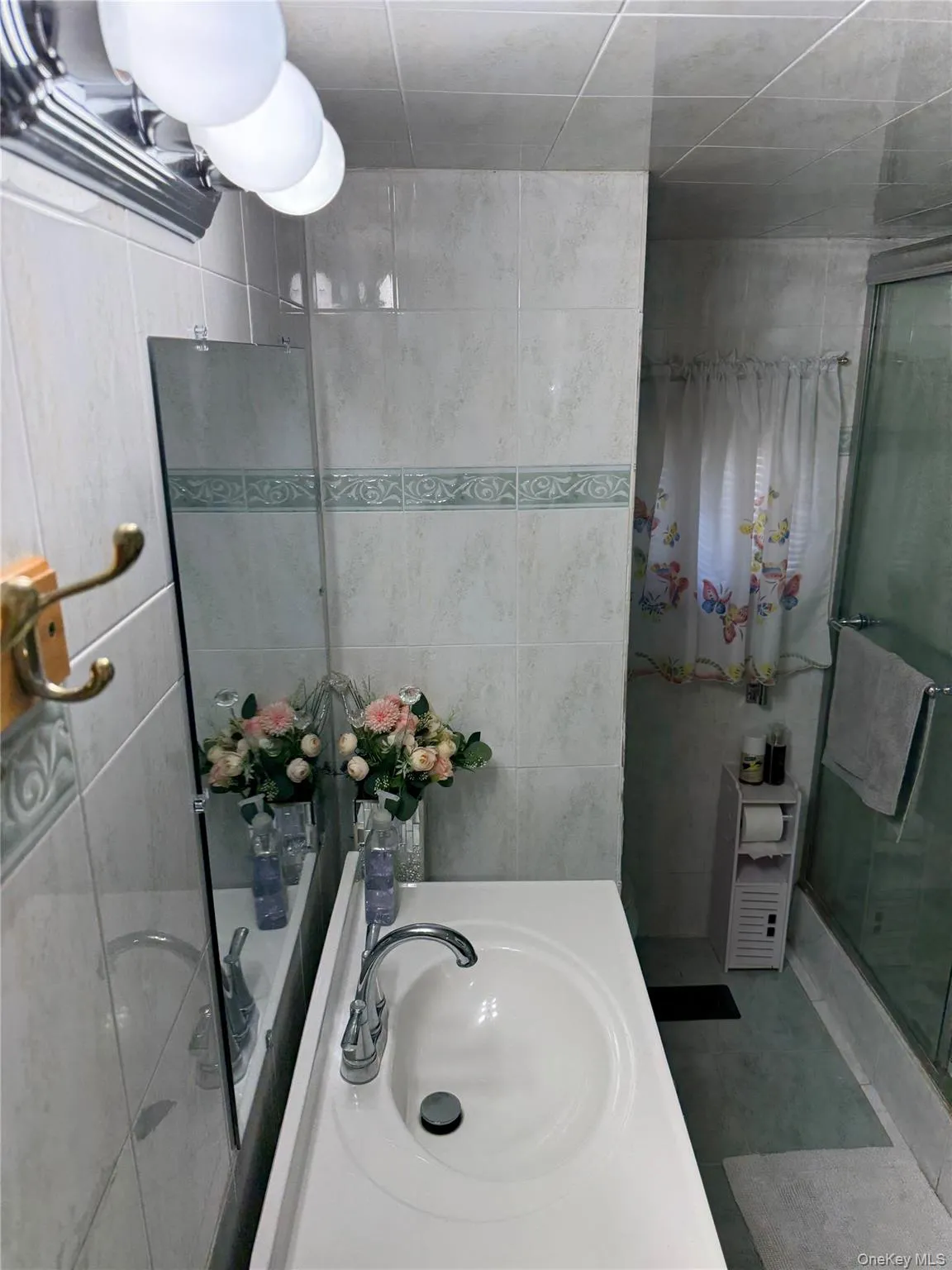Bathroom vanity with integrated sink and chrome faucet Bathroom vanity with integrated sink and chrome faucet