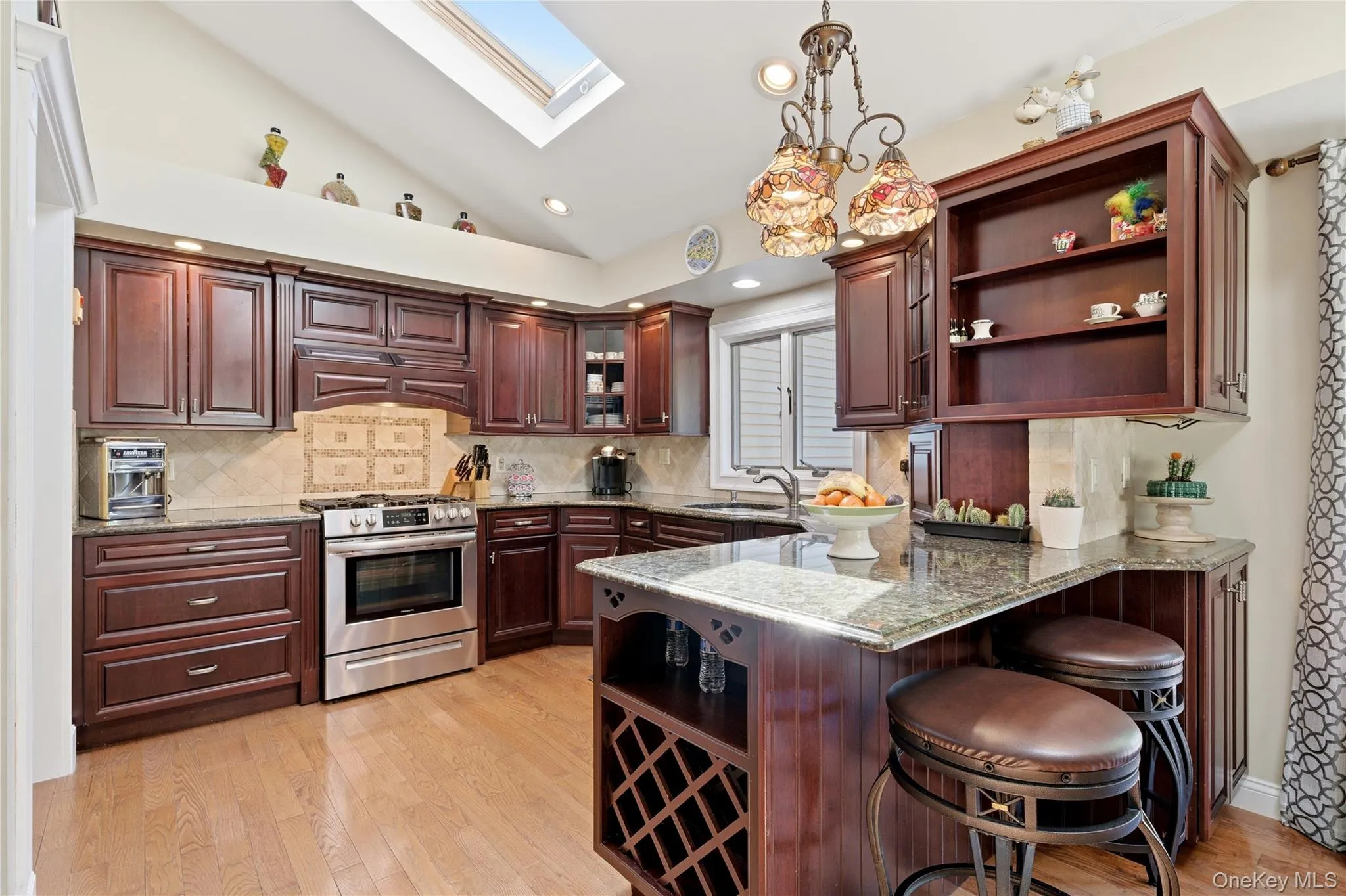 Island Seating & Overhead Island Lighting, 5 Burner Gas Stove/Oven w/Exhaust Fan Island Seating & Overhead Island Lighting, 5 Burner Gas Stove/Oven w/Exhaust Fan