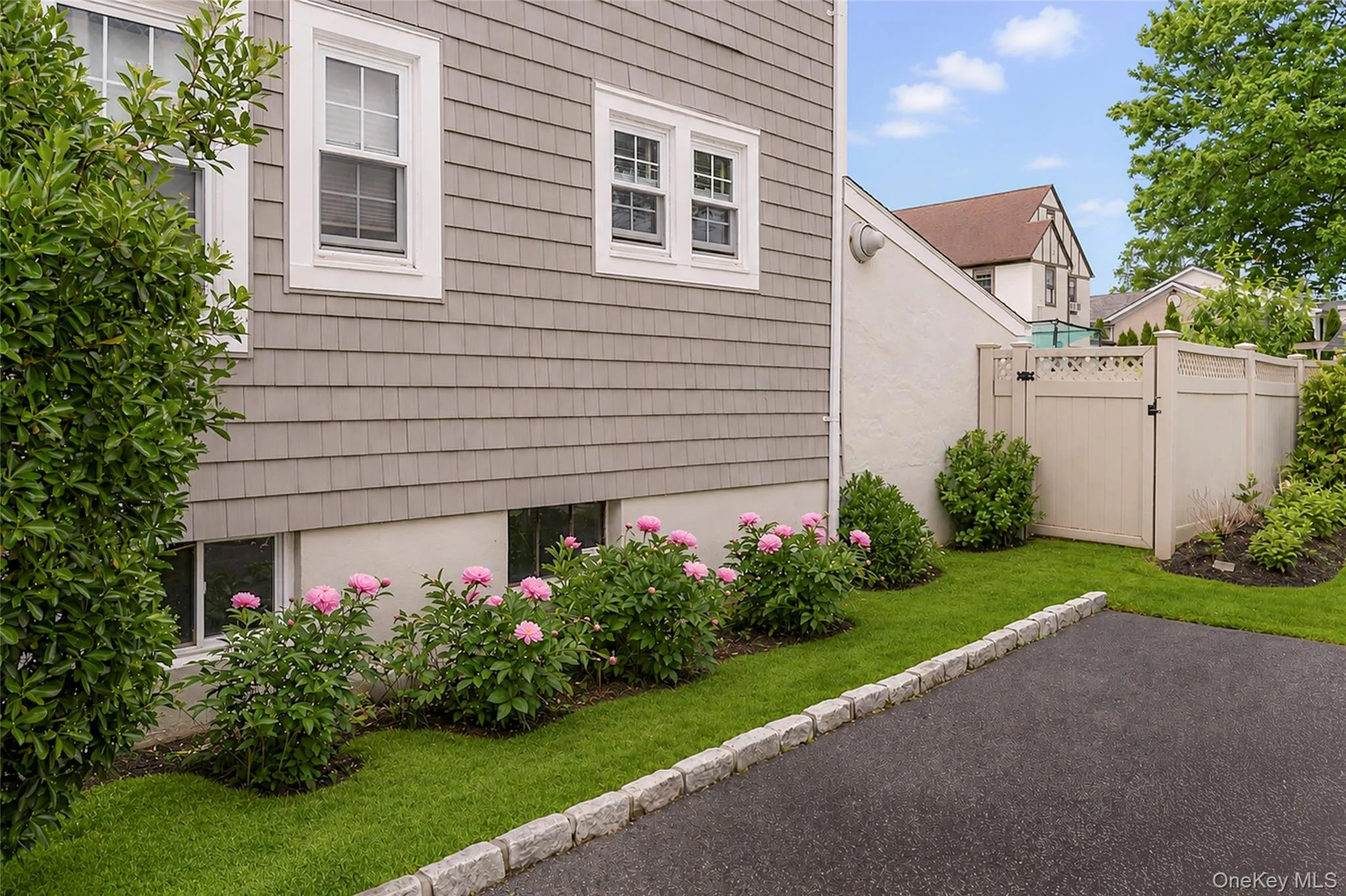Meticulously manicured landscape showing perennial peonies. Meticulously manicured landscape showing perennial peonies.