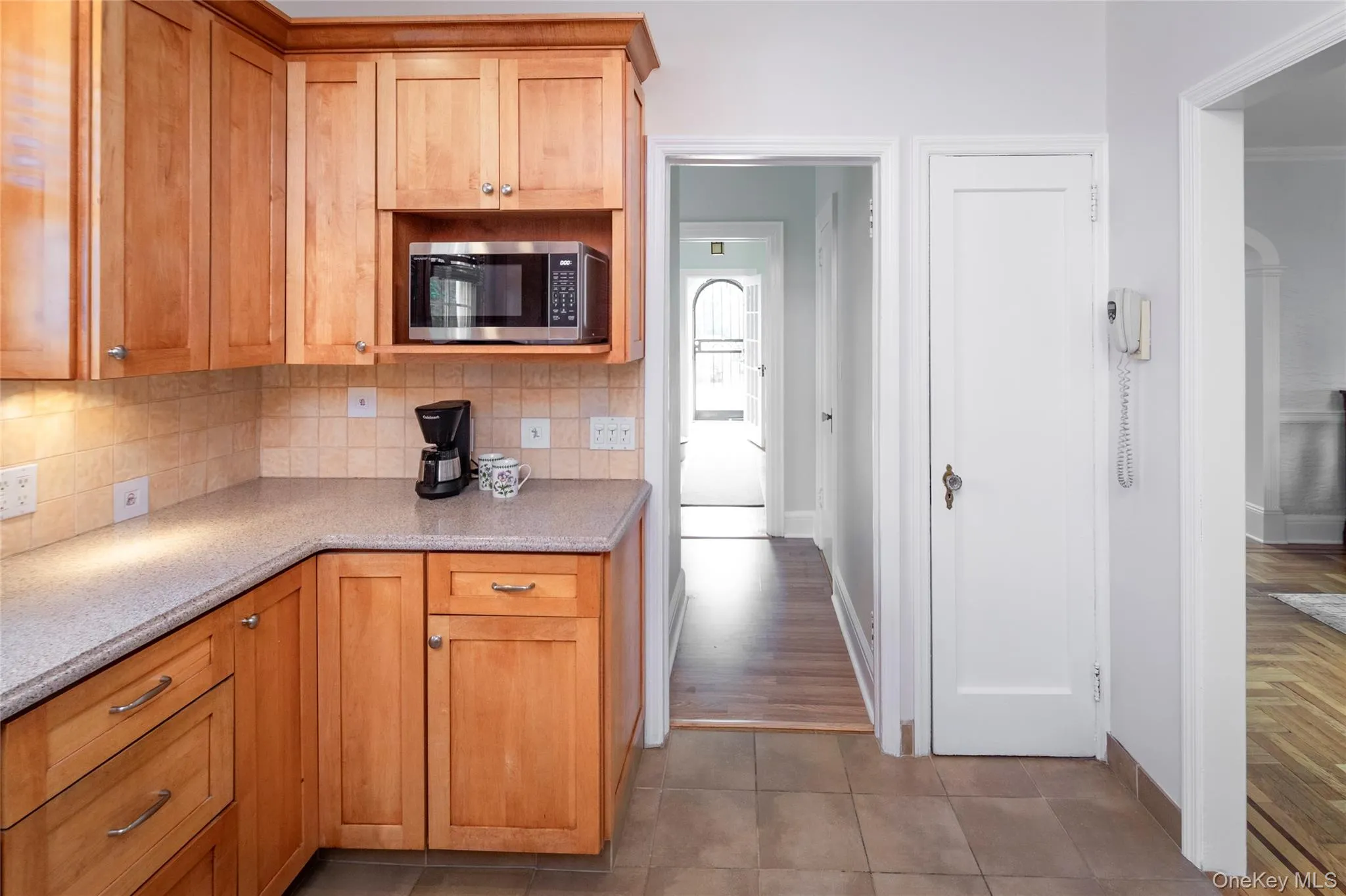 View from the Kitchen to the Entry Hall and Formal Dining Room. View from the Kitchen to the Entry Hall and Formal Dining Room.