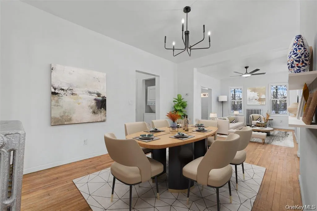 Virtually Staged Generouslysized dining space seamlesslyconnecting to the living room,ideal for entertaining andeveryday Virtually Staged Generouslysized dining space seamlesslyconnecting to the living room,ideal for entertaining andeveryday