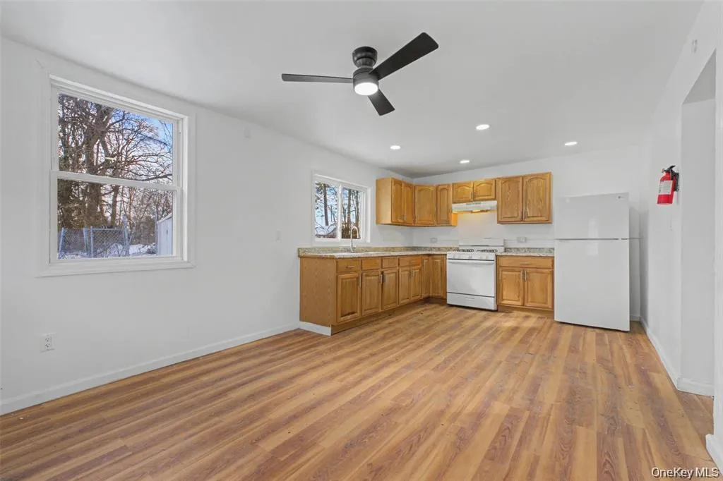 generous counter space, warmwood cabinetry, and room for adining table make this kitchenboth functional and inviting. generous counter space, warmwood cabinetry, and room for adining table make this kitchenboth functional and inviting.