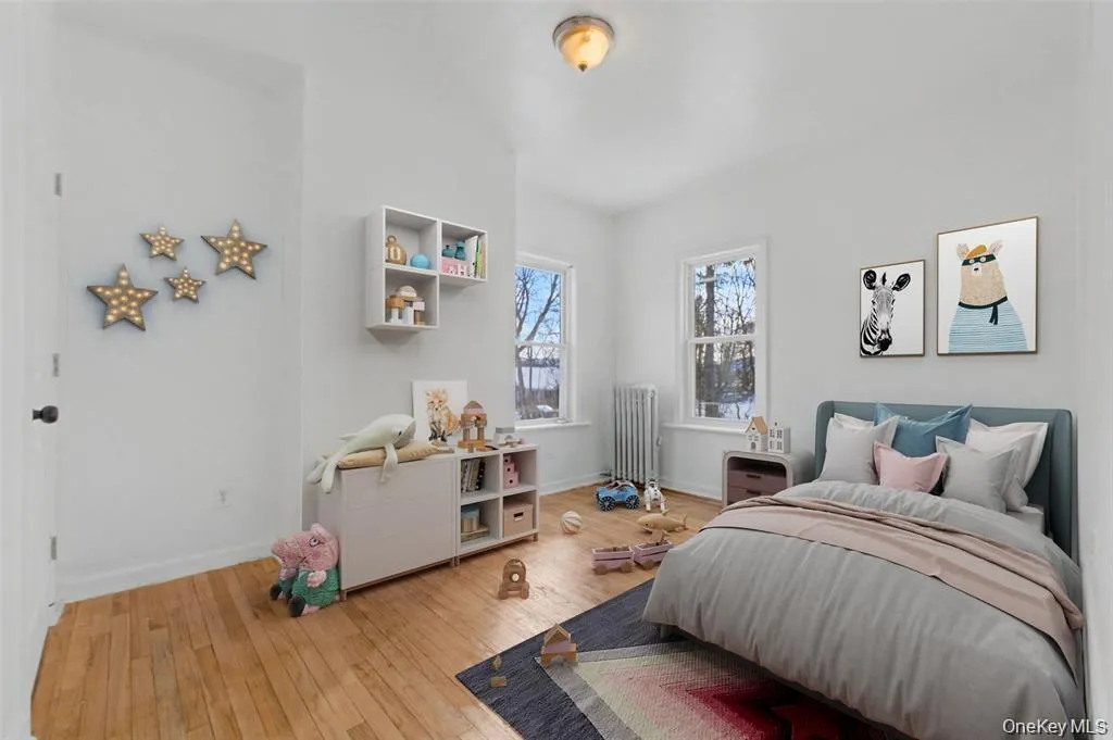 Virtually Staged Generouslysized bedroom offeringversatility as a guest room,home office, or additionalliving space. Virtually Staged Generouslysized bedroom offeringversatility as a guest room,home office, or additionalliving space.