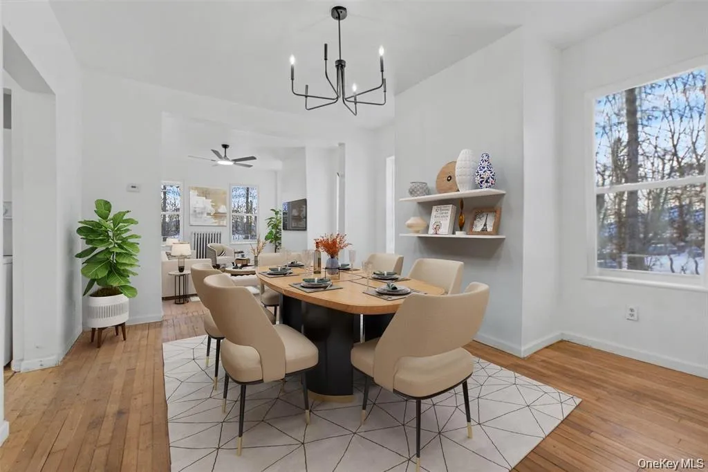 Virtually Staged Expansivedining area flowing into theadjacent living space, creatingan open and airy atmosphere. Virtually Staged Expansivedining area flowing into theadjacent living space, creatingan open and airy atmosphere.