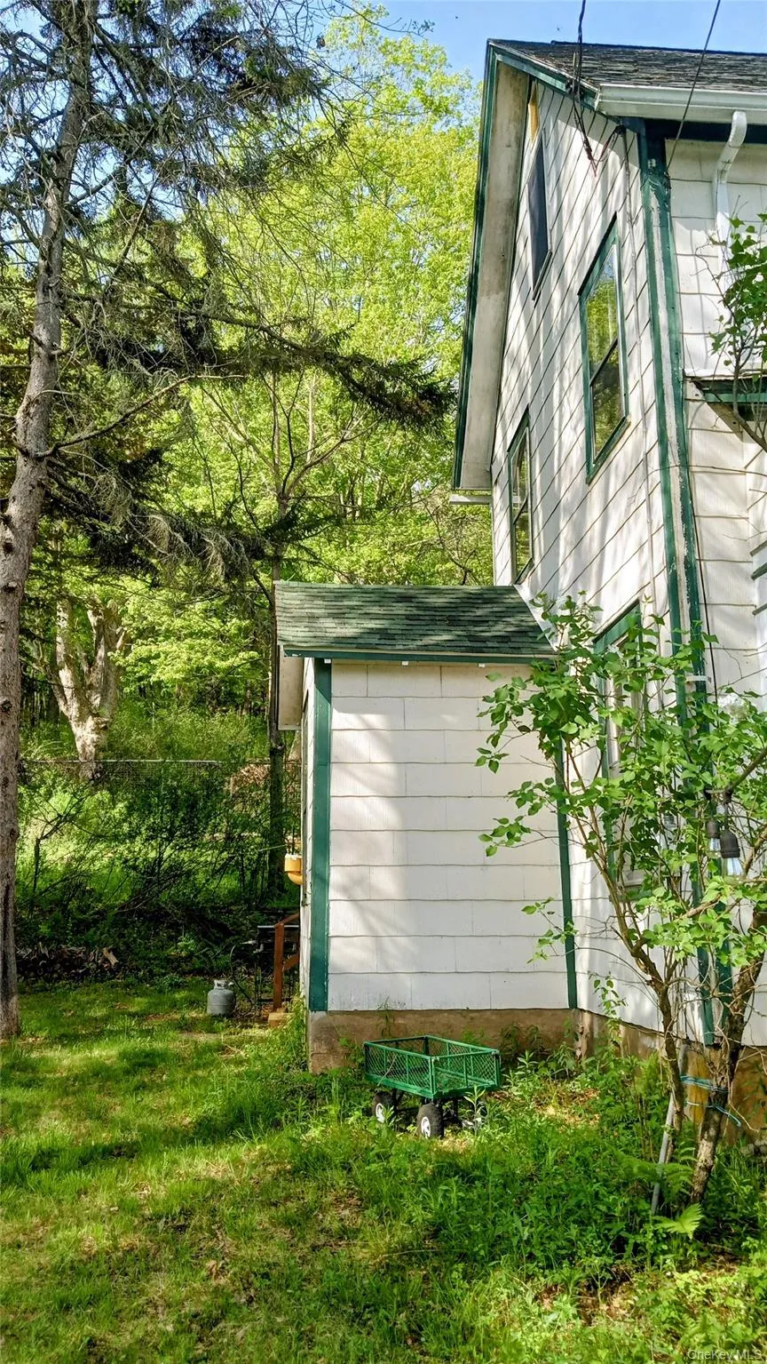 Side of home with an entrance Side of home with an entrance