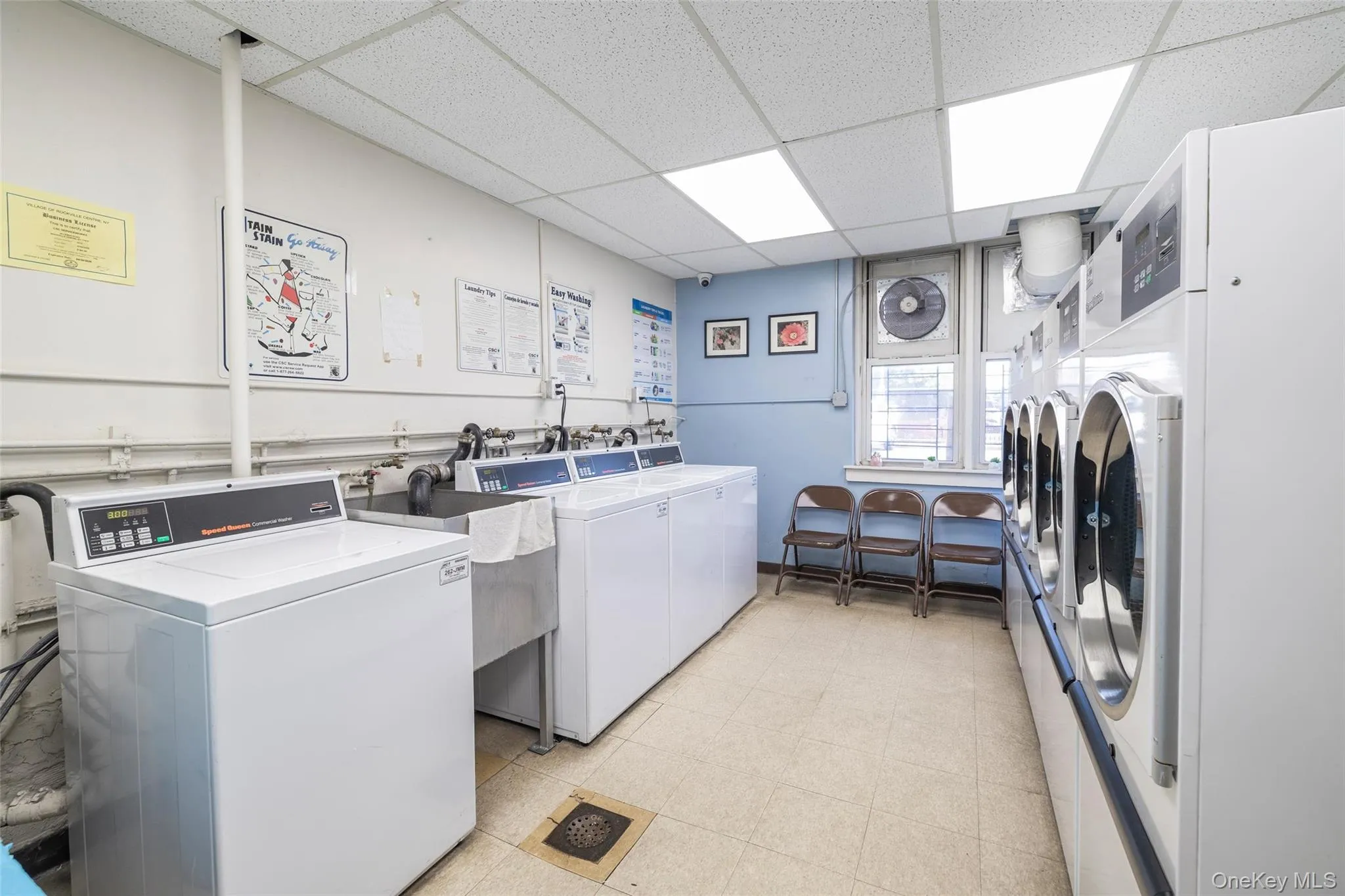 Dedicated laundry facility featuring multiple commercial-grade washers and dryers Dedicated laundry facility featuring multiple commercial-grade washers and dryers