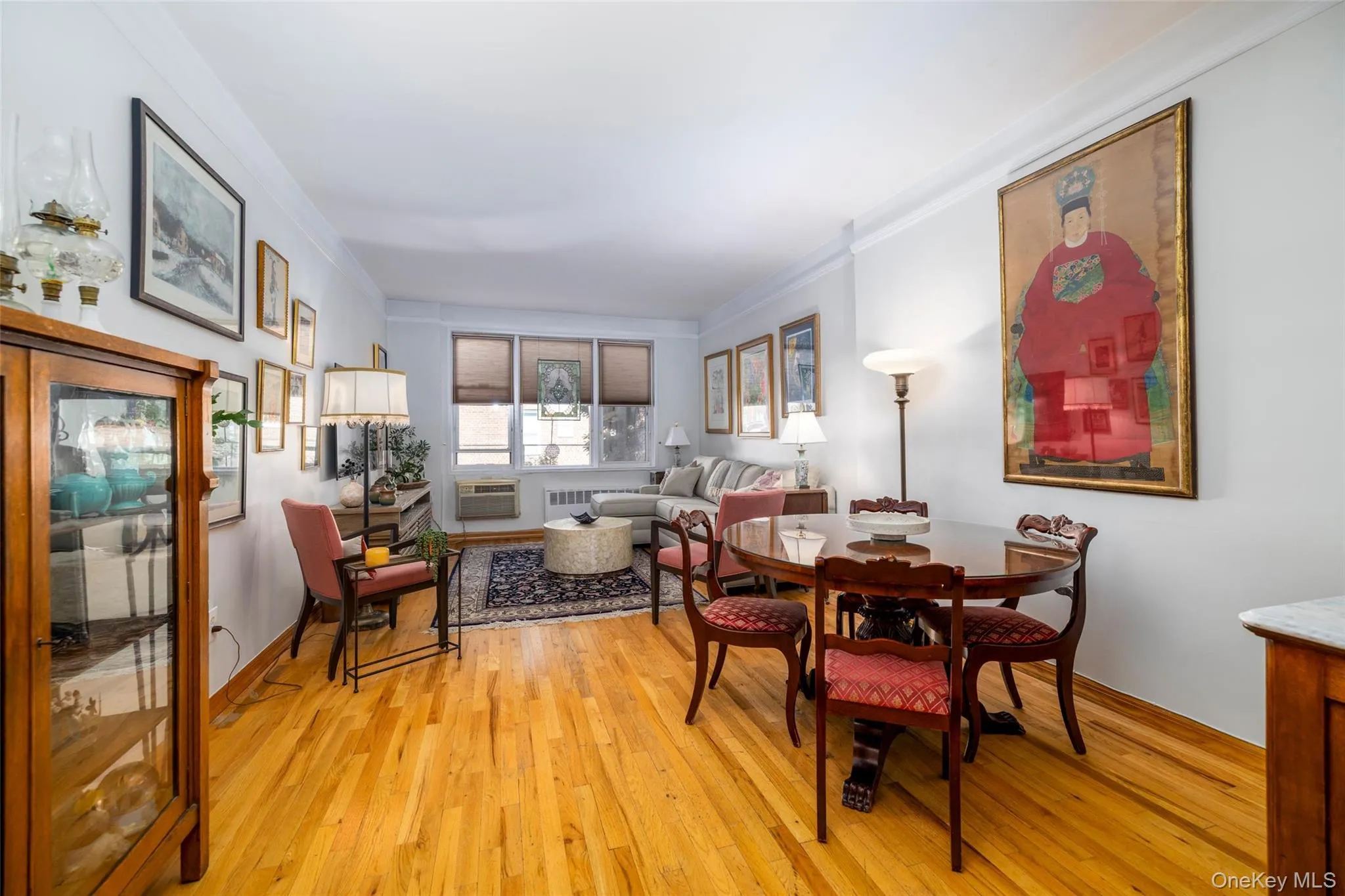 Hardwood flooring spanning the living and dining areas Hardwood flooring spanning the living and dining areas