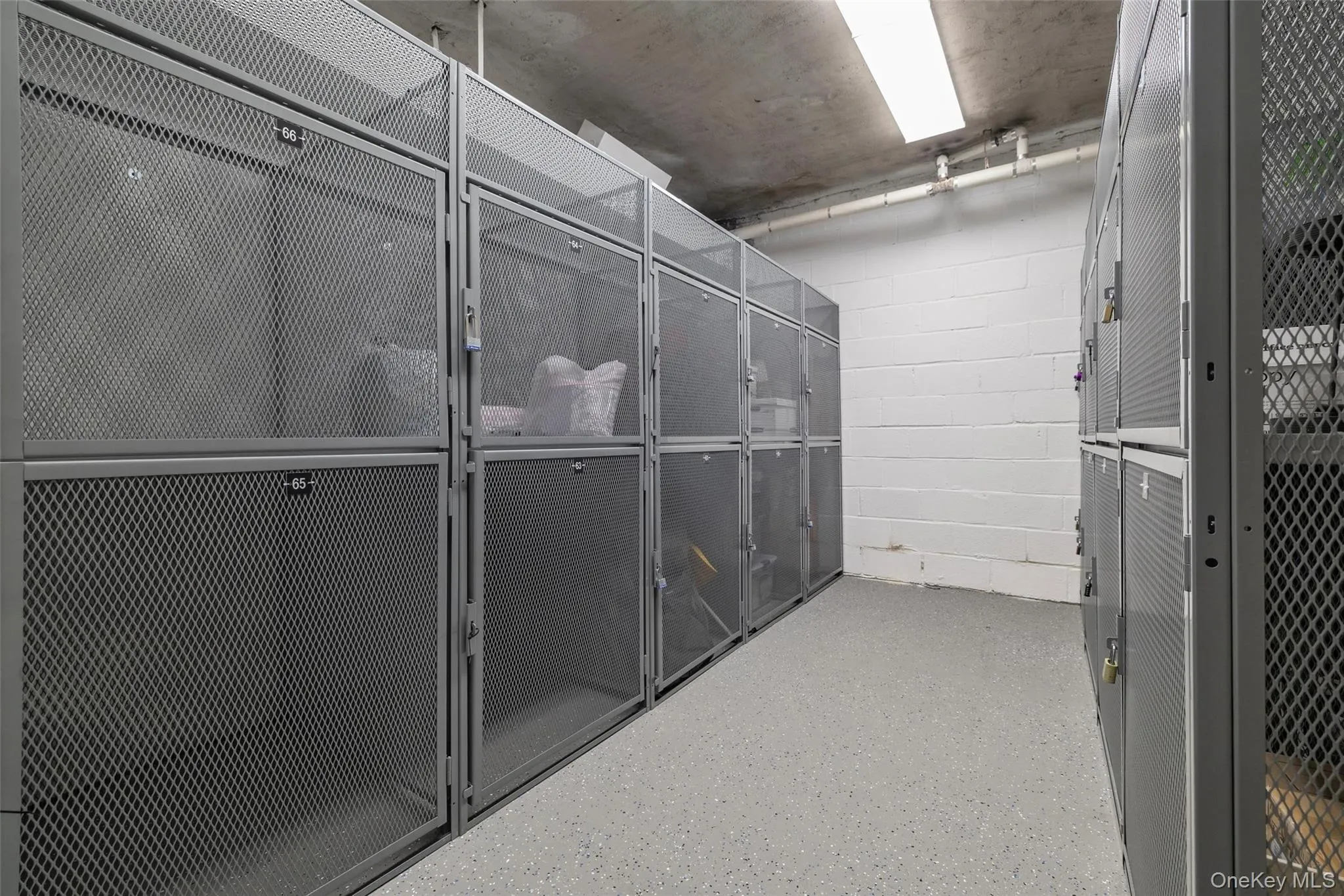 Individual storage lockers featuring metal mesh construction Individual storage lockers featuring metal mesh construction