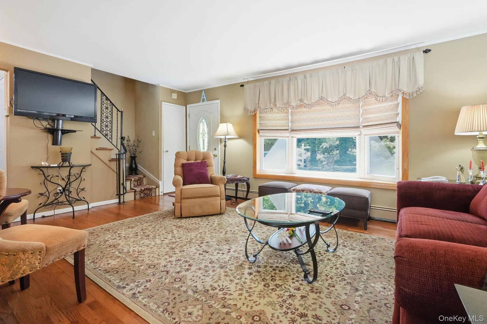 Living Room w/Staircase to Upstairs. Living Room w/Staircase to Upstairs.