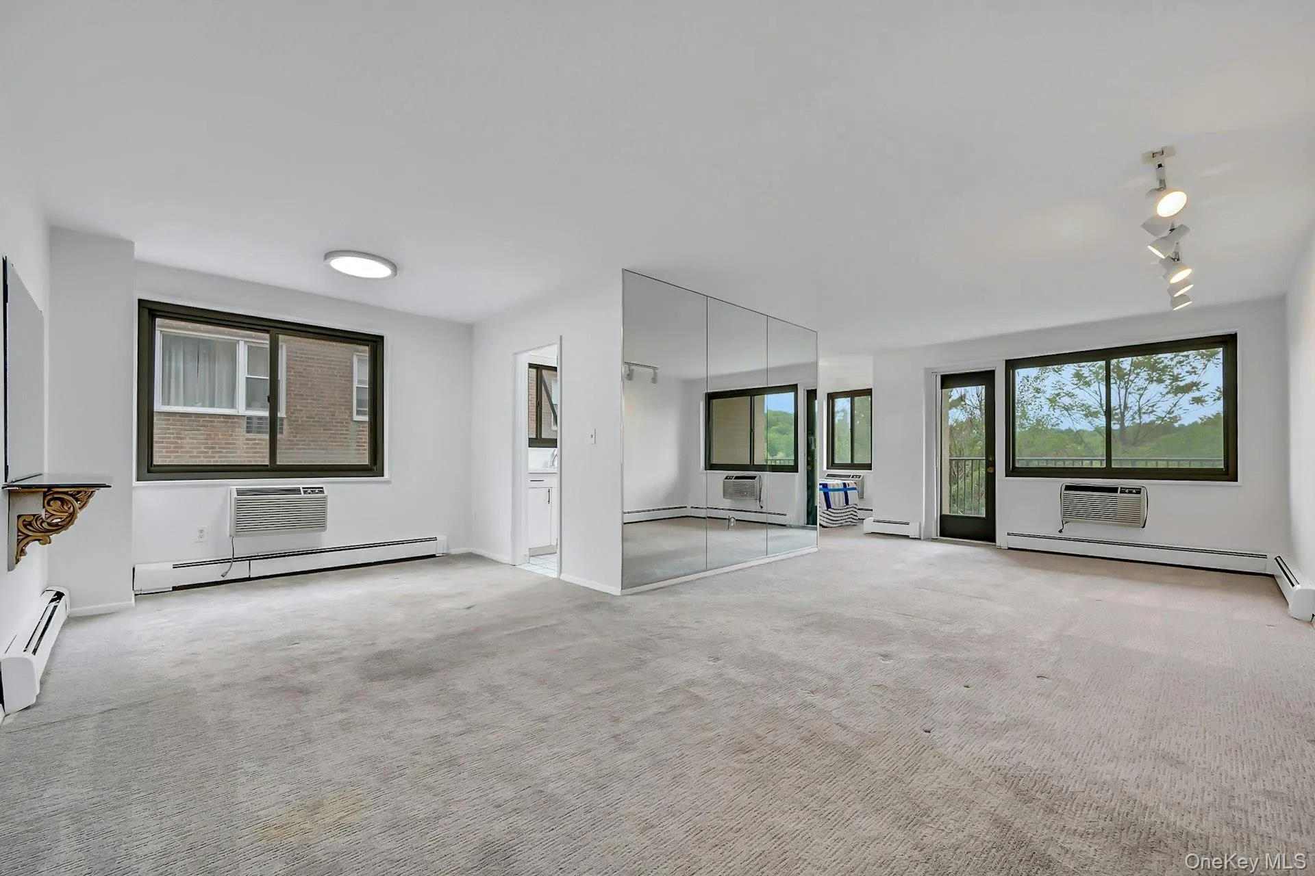 Open floor plan with dining room, living room, door to terrace with expansive year round golf course views. Open floor plan with dining room, living room, door to terrace with expansive year round golf course views.