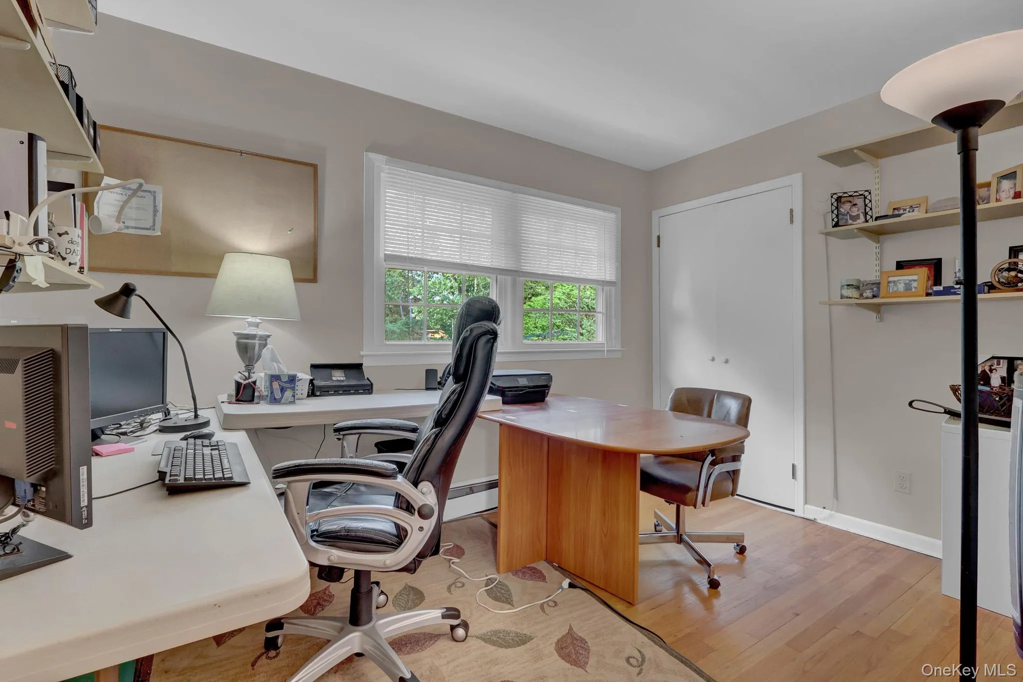 Room featuring hardwood flooring and light neutral wall paint Room featuring hardwood flooring and light neutral wall paint