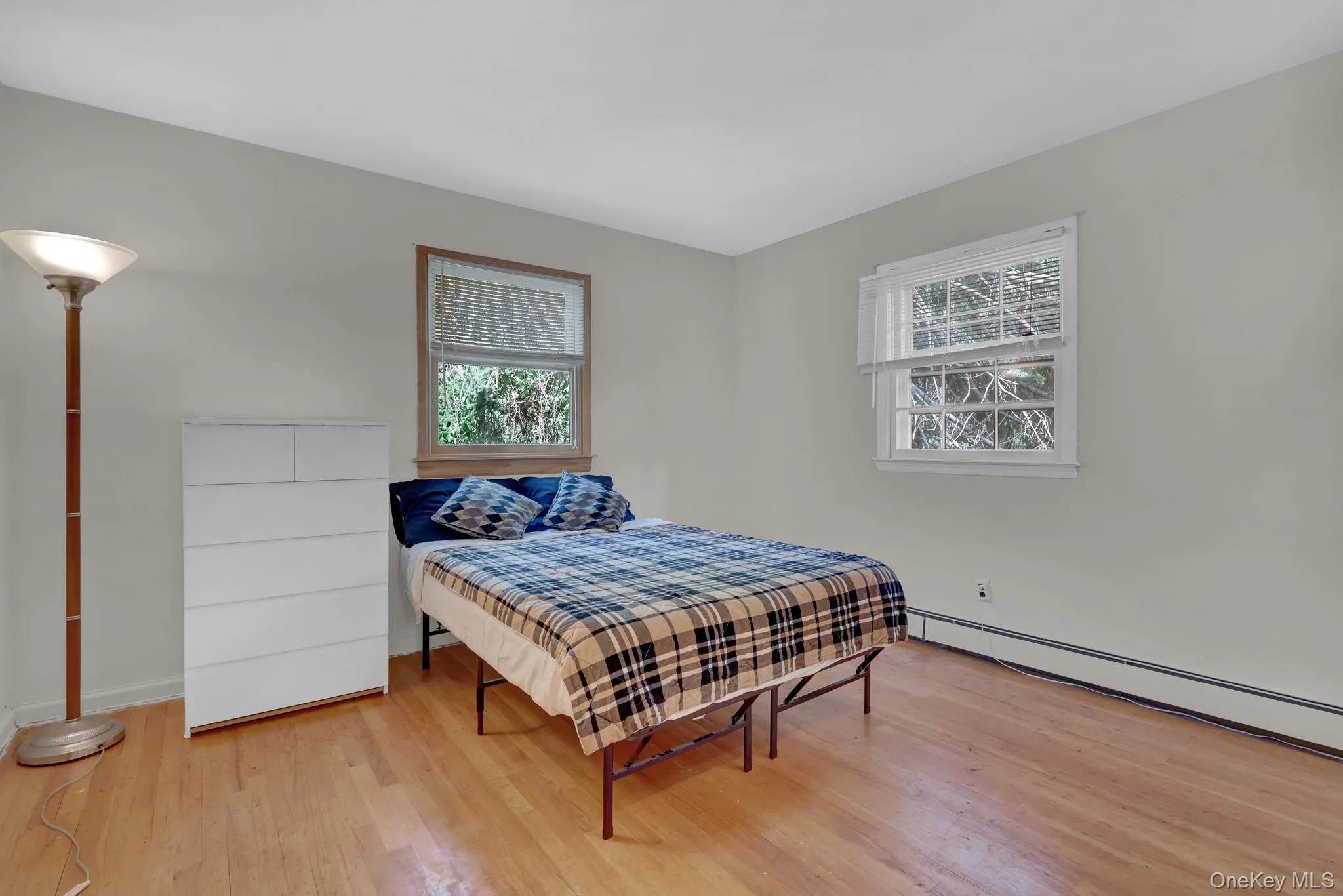 Light-toned wood-finish flooring complements neutral wall tones Light-toned wood-finish flooring complements neutral wall tones