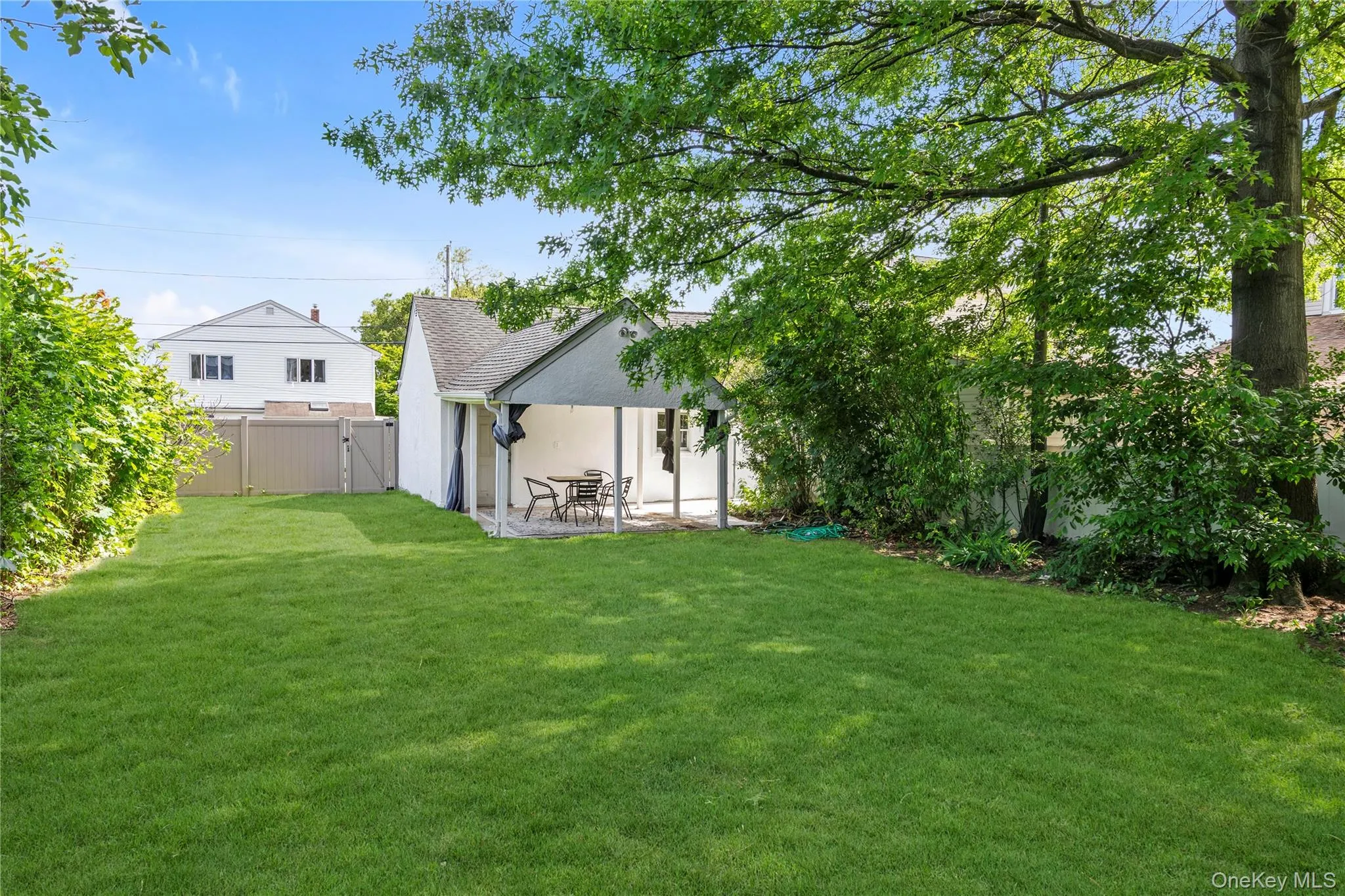 Large yard with covered patio Large yard with covered patio