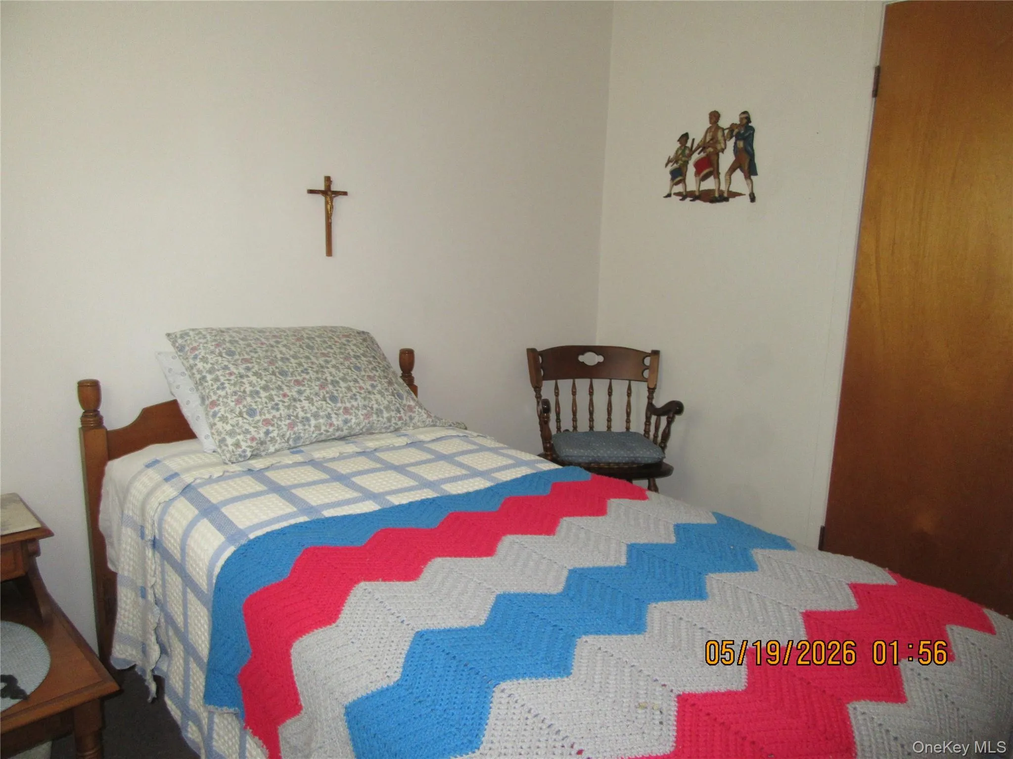 Bedroom with neutral painted walls and carpeting Bedroom with neutral painted walls and carpeting