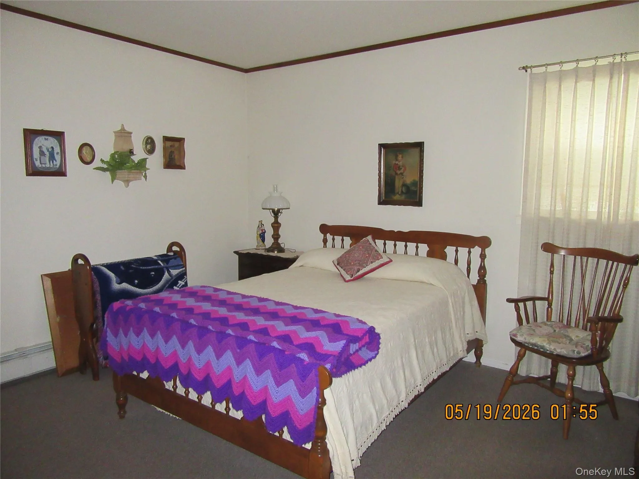 Bedroom featuring neutral wall paint and darker trim Bedroom featuring neutral wall paint and darker trim