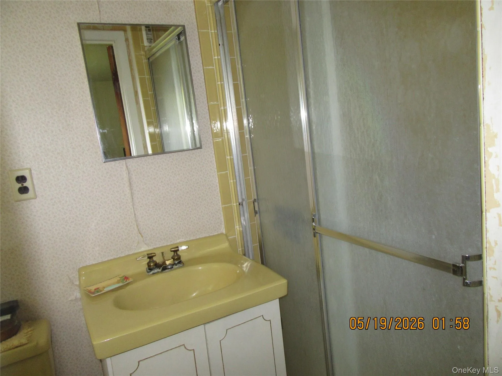 Bathroom vanity with a yellow sink and white cabinet base Bathroom vanity with a yellow sink and white cabinet base