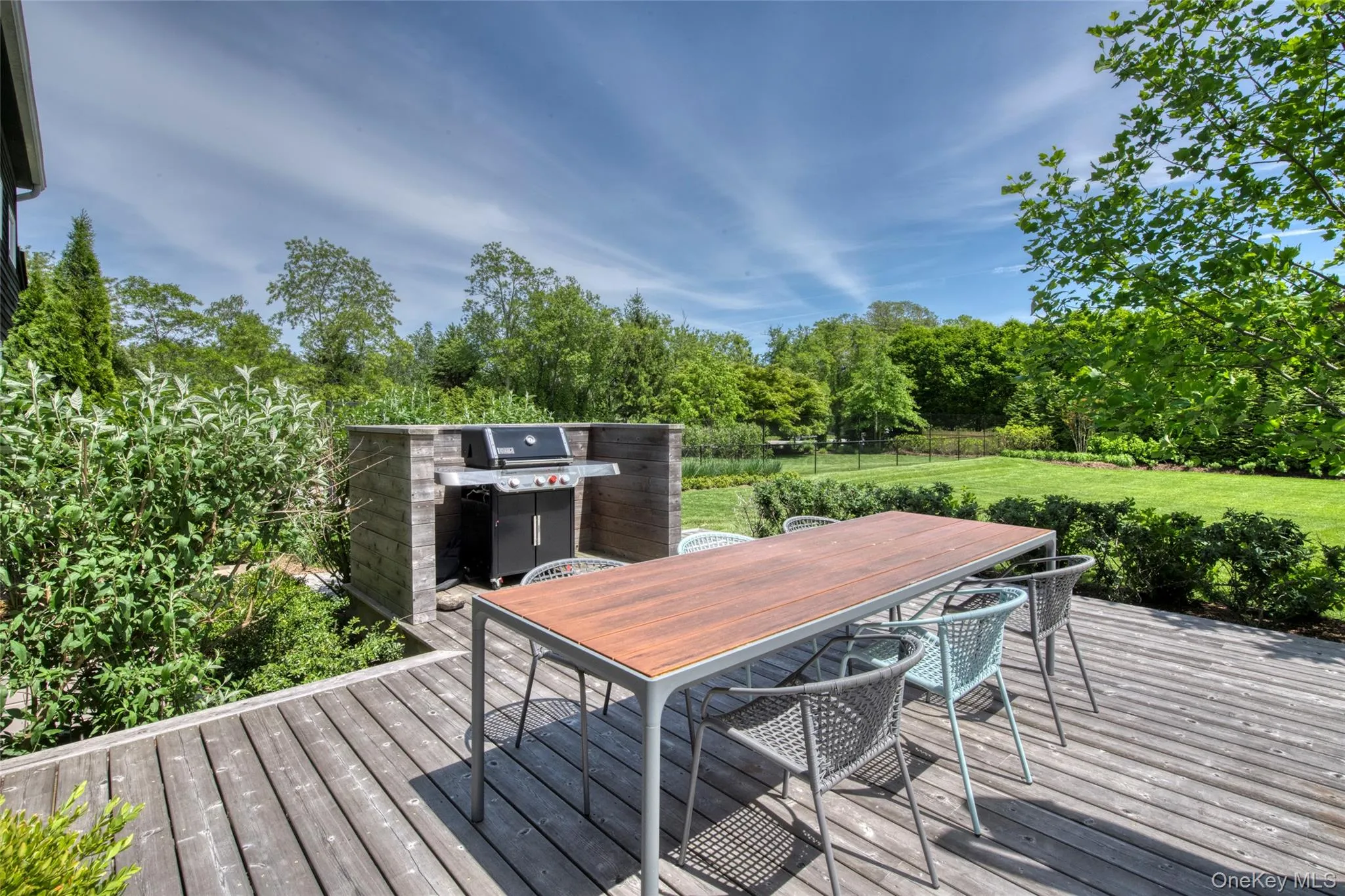 Main House: deck outside kitchen for outdoor dining Main House: deck outside kitchen for outdoor dining