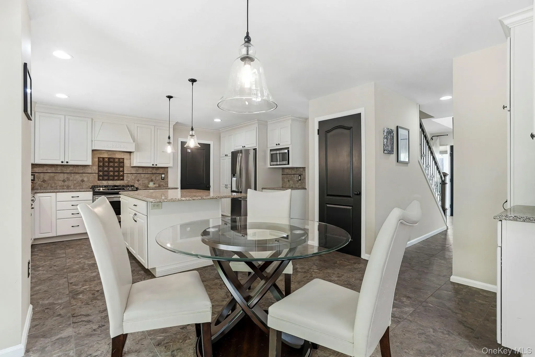 Take note of the door to the left of the fridge - step right out to the garage. Offloading a grocery run will be a breeze. Take note of the door to the left of the fridge - step right out to the garage. Offloading a grocery run will be a breeze.